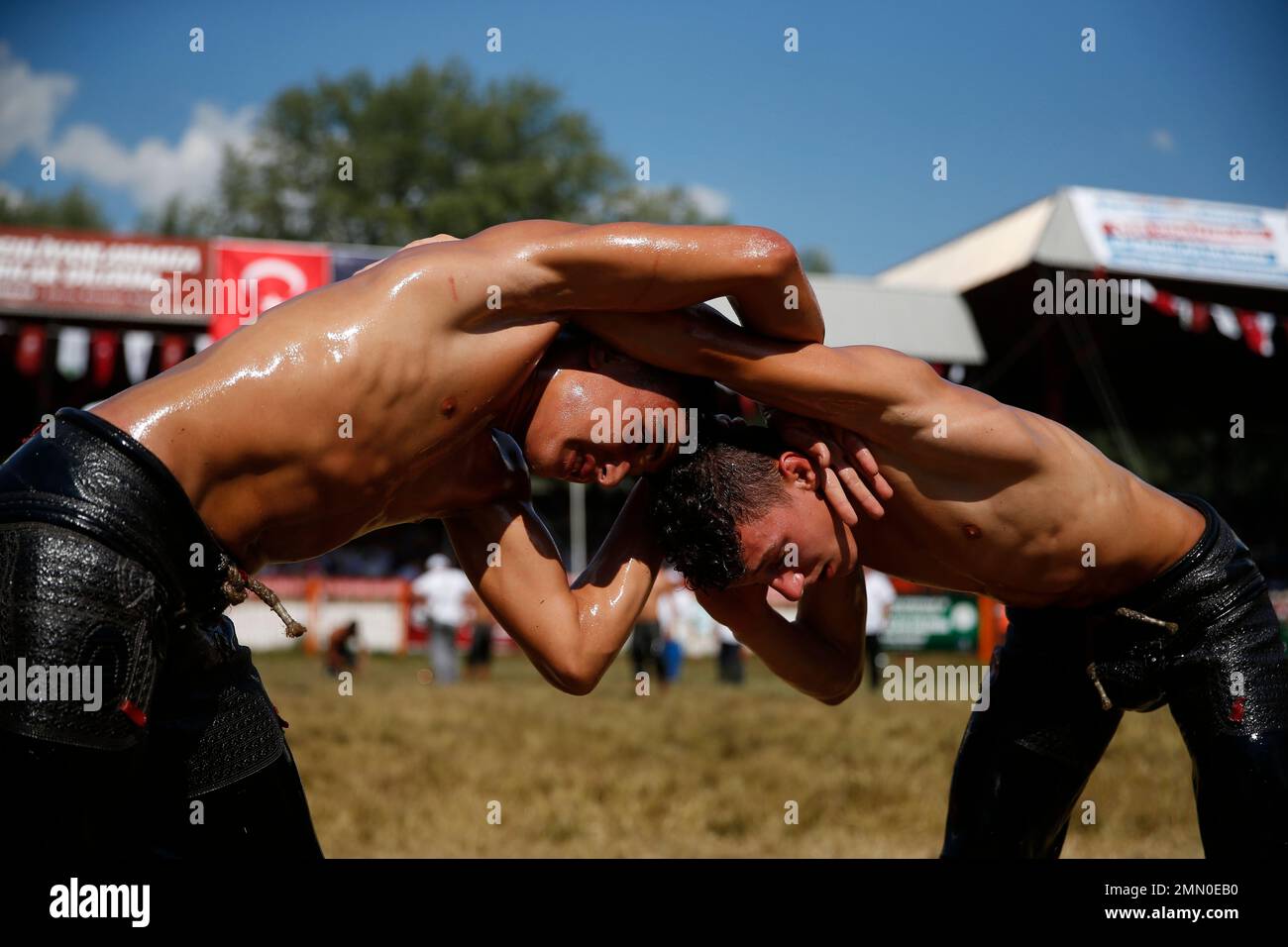 In this Sunday, July 15, 2018 photo, participants wrestle during the