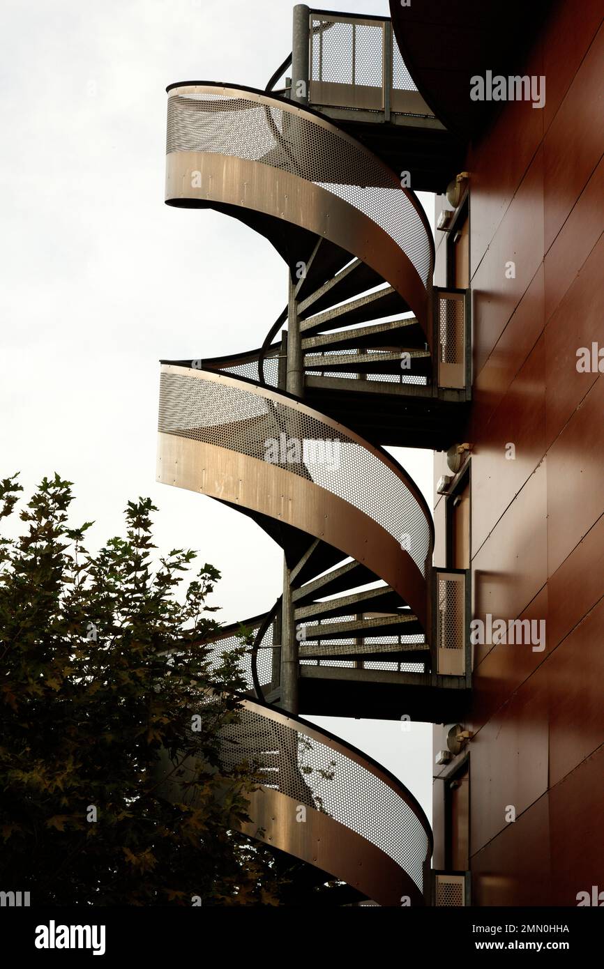 France, Pyrenees Atlantiques, Bearn, Pau, metal spiral staircase on the side facade of a contemporary building Stock Photo