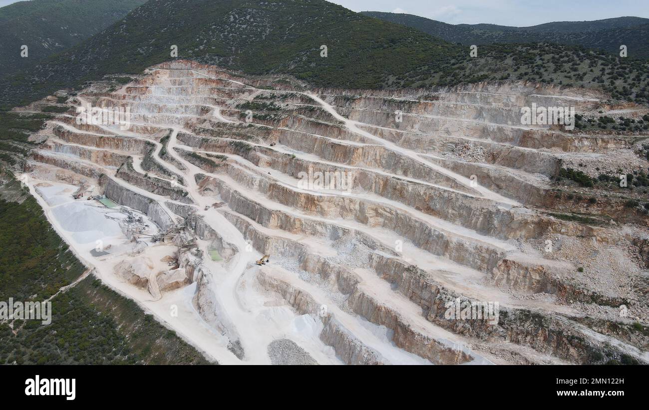 Limestone quarry or calcium carbonate quarry with mining terraces, Industrial area. Stock Photo