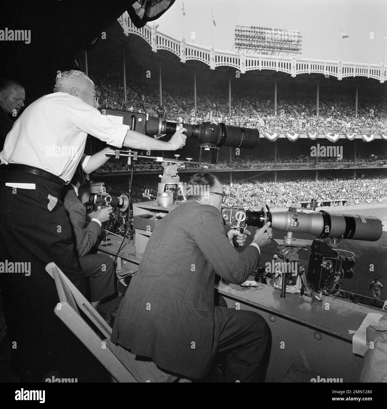 Photographers of the Associated Press are pictured at work in Yankee  Stadium in New York, covering the second game of the 1961 World Series  between the New York Yankees and the Cincinnati