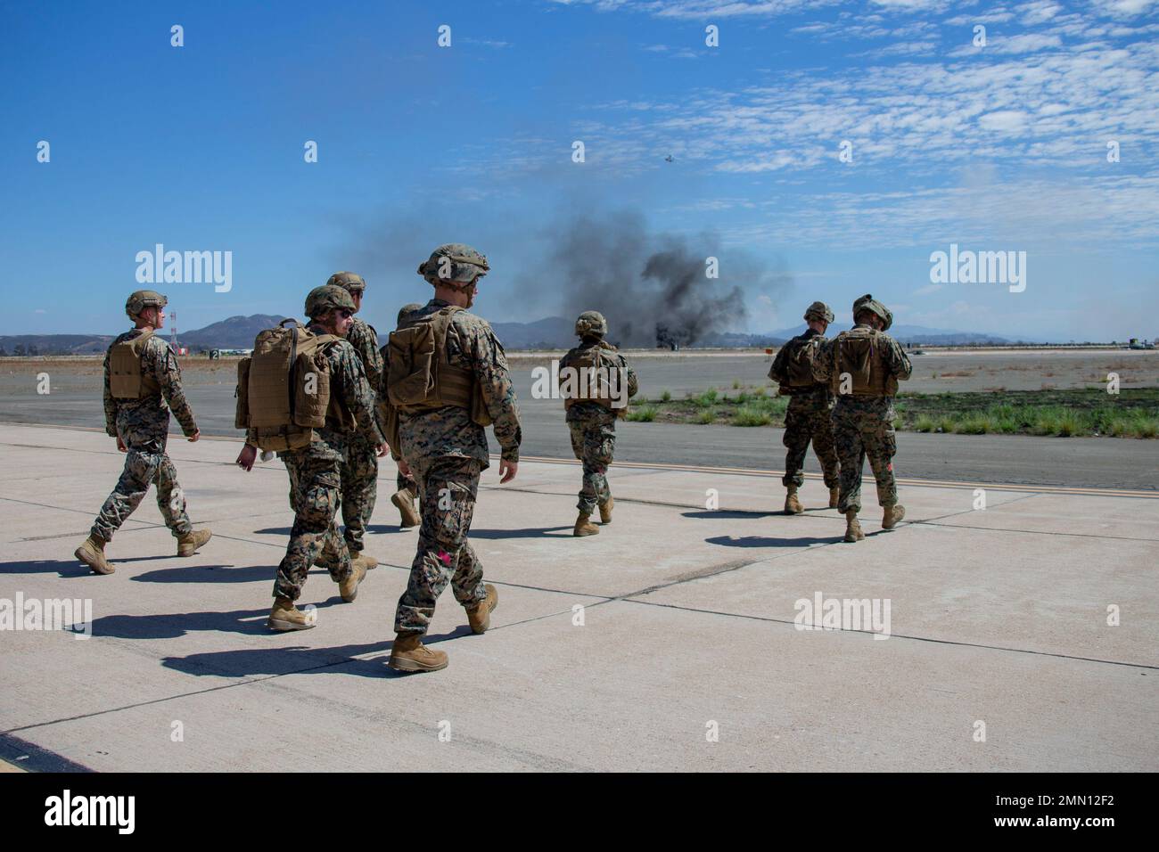 U.S. Marines with Helicopter Support Team, 1st Landing Battalion, 1st Marine Logistics Group, stand by for the drop off of a Joint Light Tactical Vehicle from Marine Heavy Helicopter Squadron 465 during the Marine Air-Ground Task Force demonstration of the 2022 Marine Corps Air Station Miramar Air Show at MCAS Miramar, San Diego, California, Sept. 24, 2022. The MAGTF Demo displays the coordinated use of close-air support, armor, artillery and infantry forces and provides a visual representation of how the Marine Corps operates. The theme for the 2022 MCAS Miramar Air Show, “Marines Fight, Evol Stock Photo