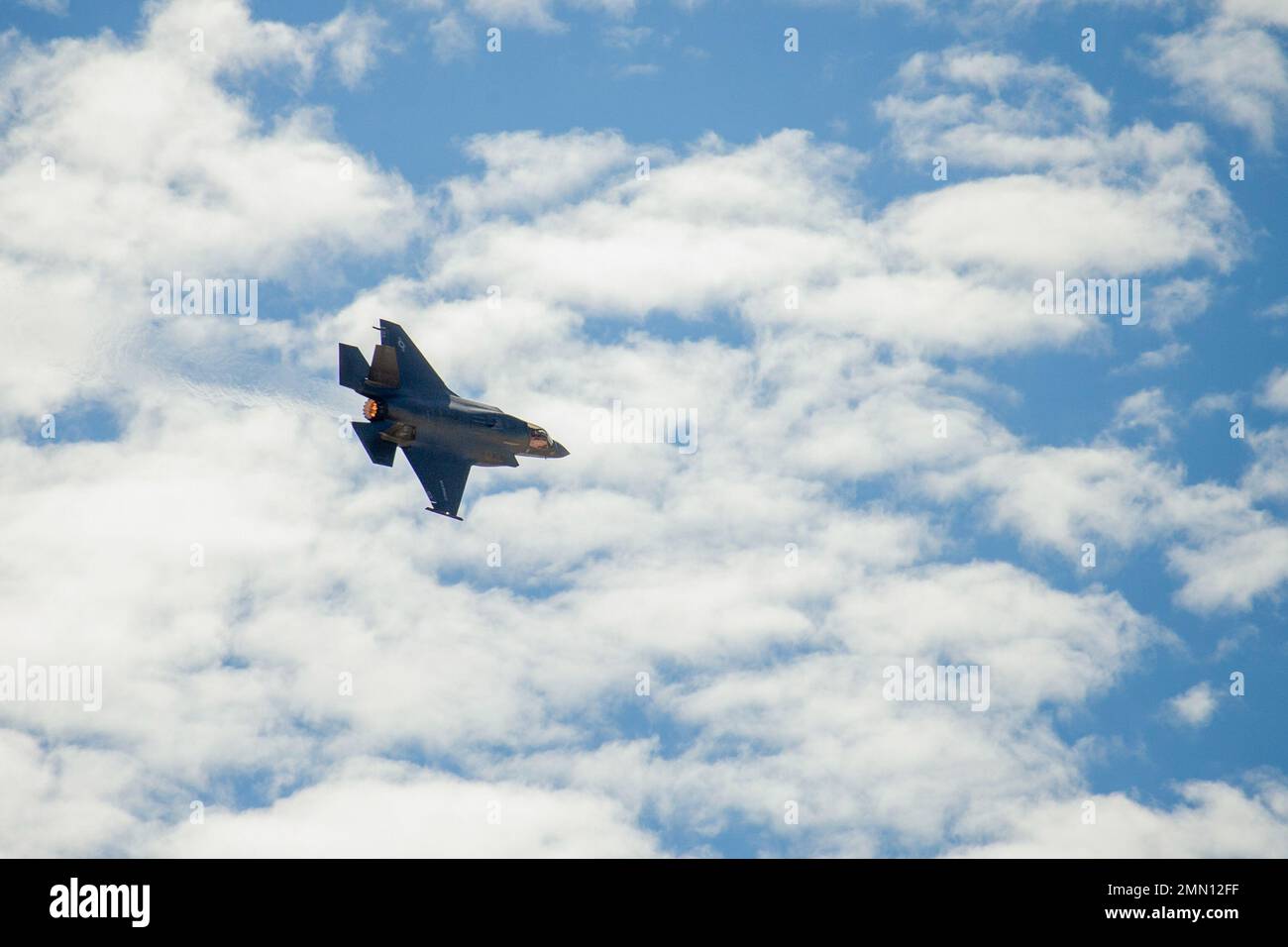 An F-35 Lightning II Hornet flies above the flight line during the Marine Air-Ground Task Force demonstration of the 2022 Marine Corps Air Station Miramar Air Show at MCAS Miramar, San Diego, California, Sept. 24, 2022. The MAGTF Demo displays the coordinated use of close-air support, artillery and infantry forces, and provides a visual representation of how the Marine Corps operates. The theme for the 2022 MCAS Miramar Air Show, “Marines Fight, Evolve and Win,” reflects the Marine Corps’ ongoing modernization efforts to prepare for future conflicts. Stock Photo