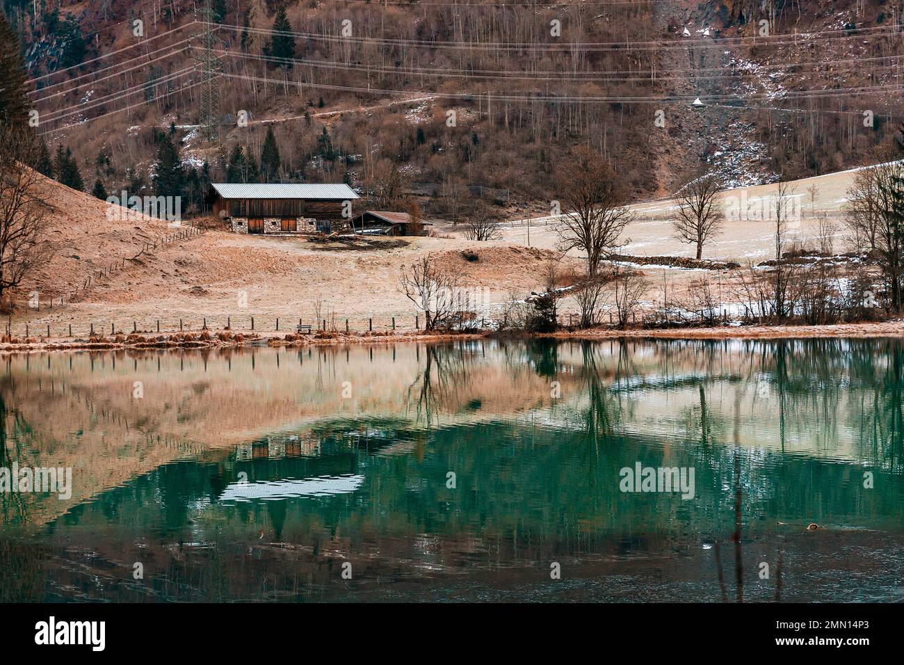 Mountain lake with water reflections at morning light. Salzburg country. Stock Photo