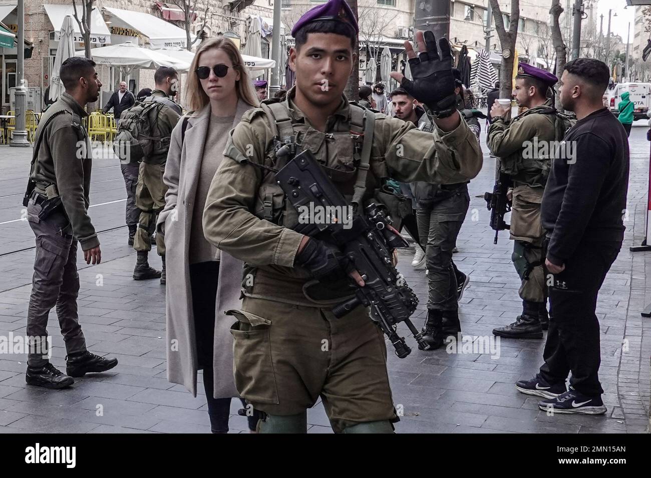 Jerusalem, Israel. 30th Jan, 2023. Border Police forces with reinforcements from the IDF Givati Brigade in purple berets, on heightened security, patrol the streets in downtown Jerusalem amid an escalation of violence following two terrorist shootings in the capital. Seven Israelis have been murdered and five injured. Credit: Nir Alon/Alamy Live News Stock Photo