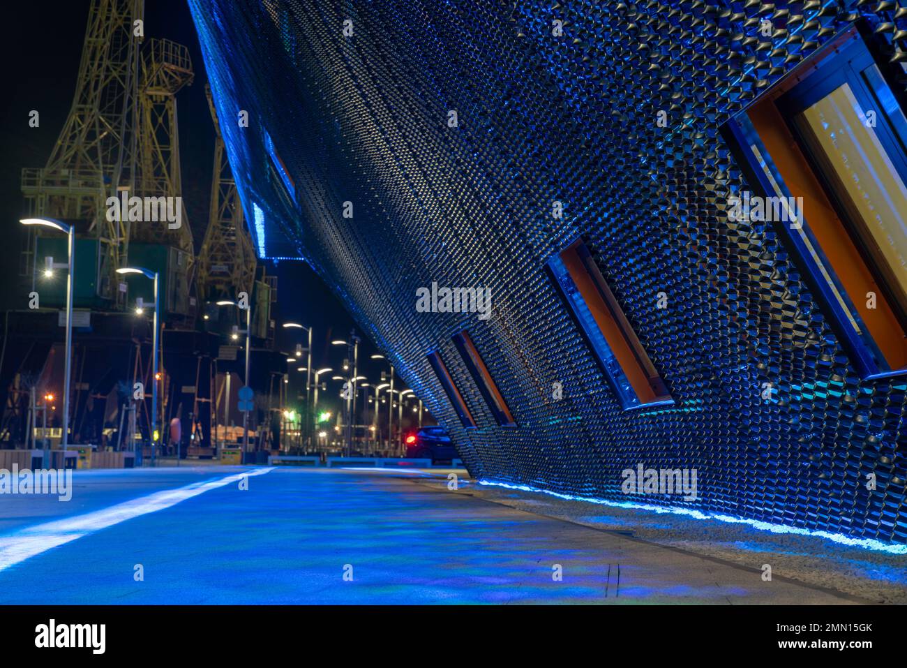 cgi backplate production.modern building illuminated with multicolored ...