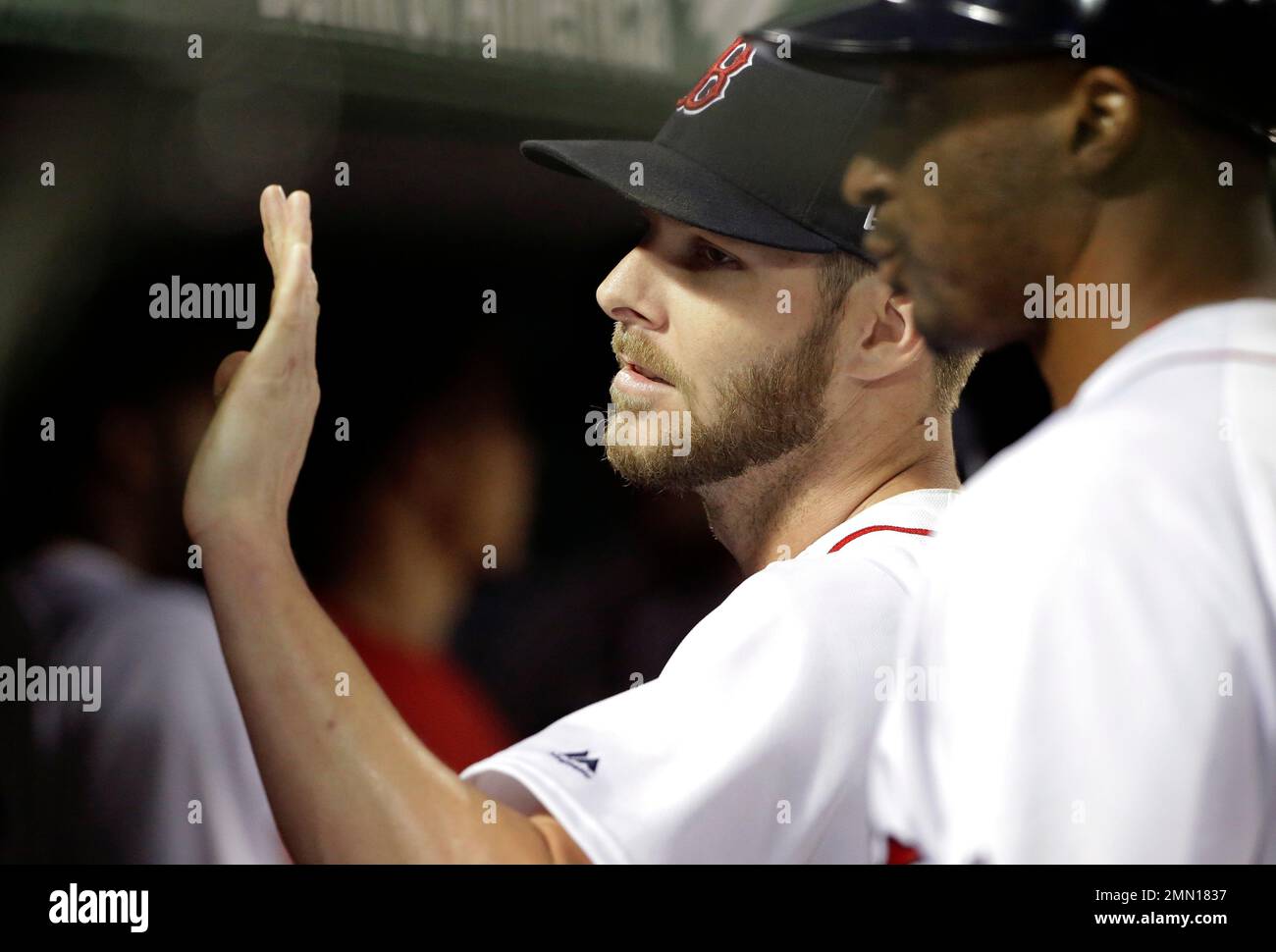 Boston Red Sox's Chris Sale picks up the rosin bag after giving up a solo  home run to Detroit Tigers' Grayson Greiner during the fifth inning of the  first game of a