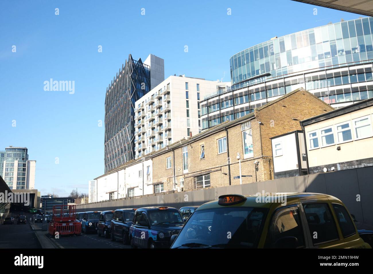 This image, taken from the Paddington Station taxi rank shows a cocktail of archtectural styes and sizes all thrown together in a small area. Stock Photo