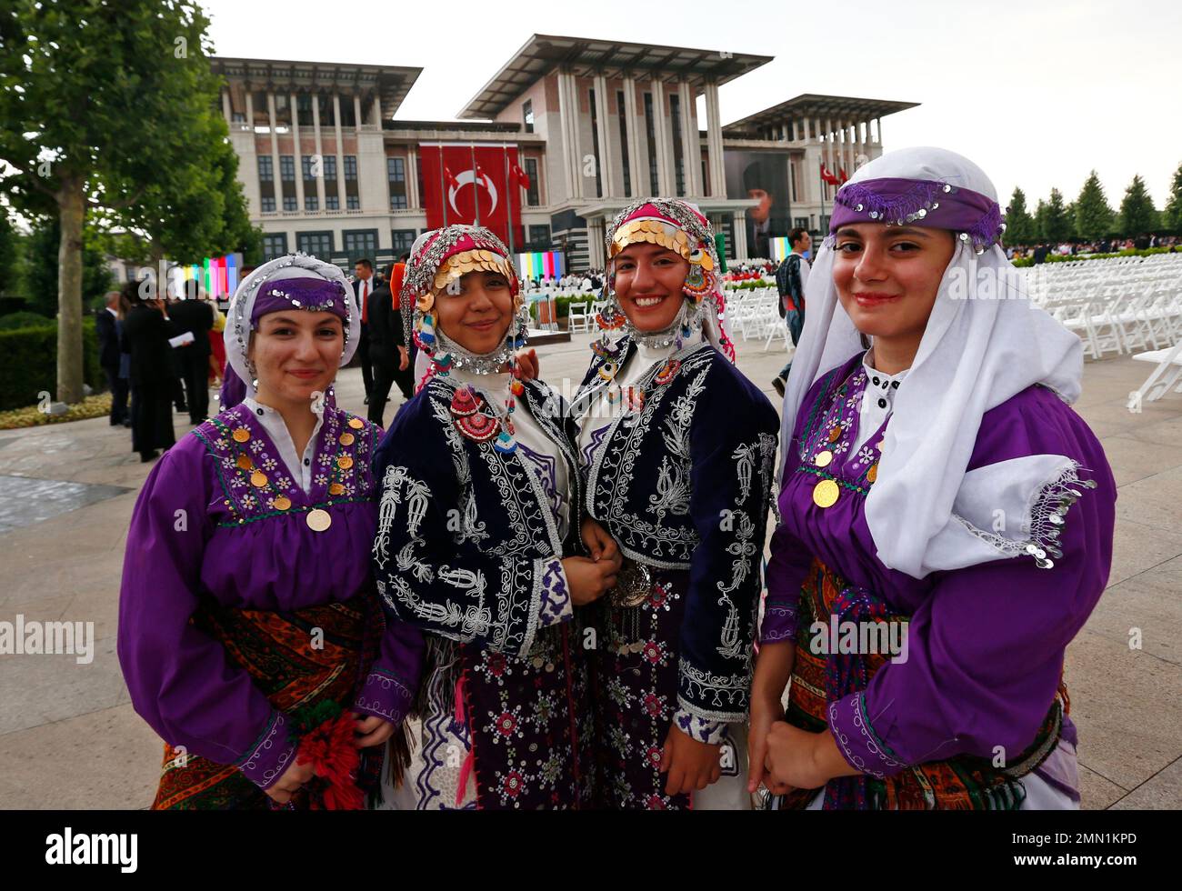 Presidential Turkish Robe Guests dressed in traditional costumes pose for photos outside the ...