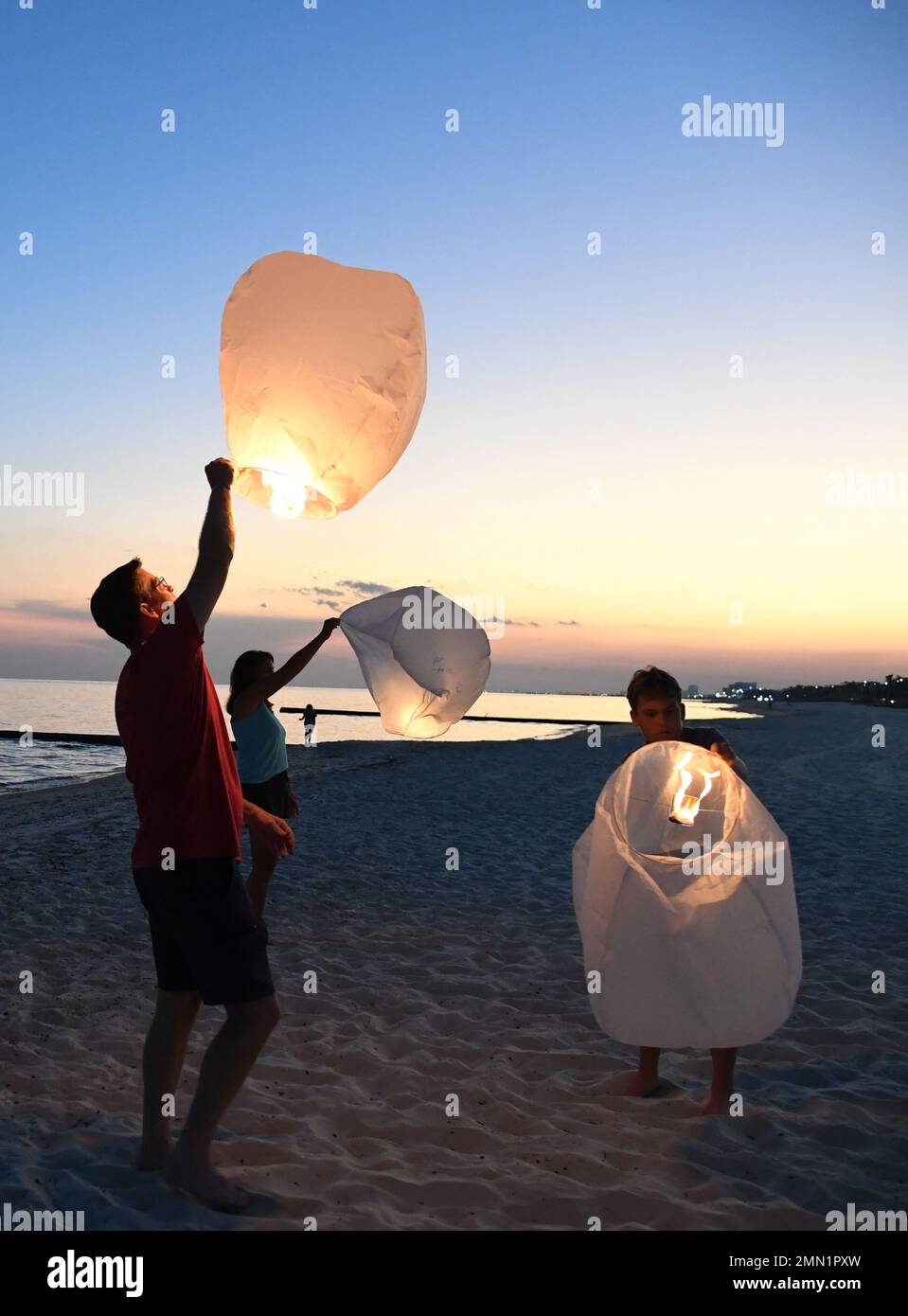 U.S. Air Force Col. C. Mike Smith, Second Air Force A3/6 commander, and his family light