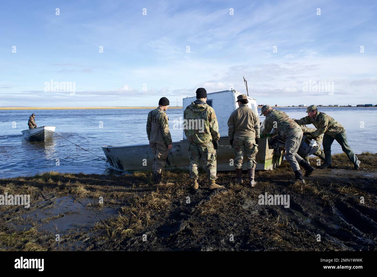 Alaska National Guardsmen assist community members of Kipnuk, Alaska in