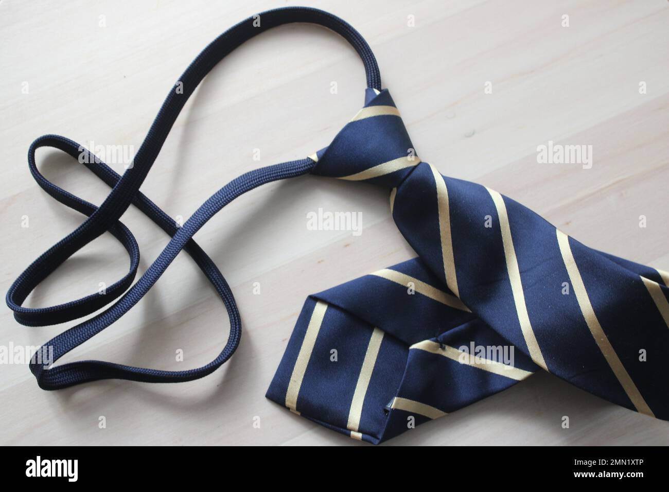 Striped necktie on table Stock Photo