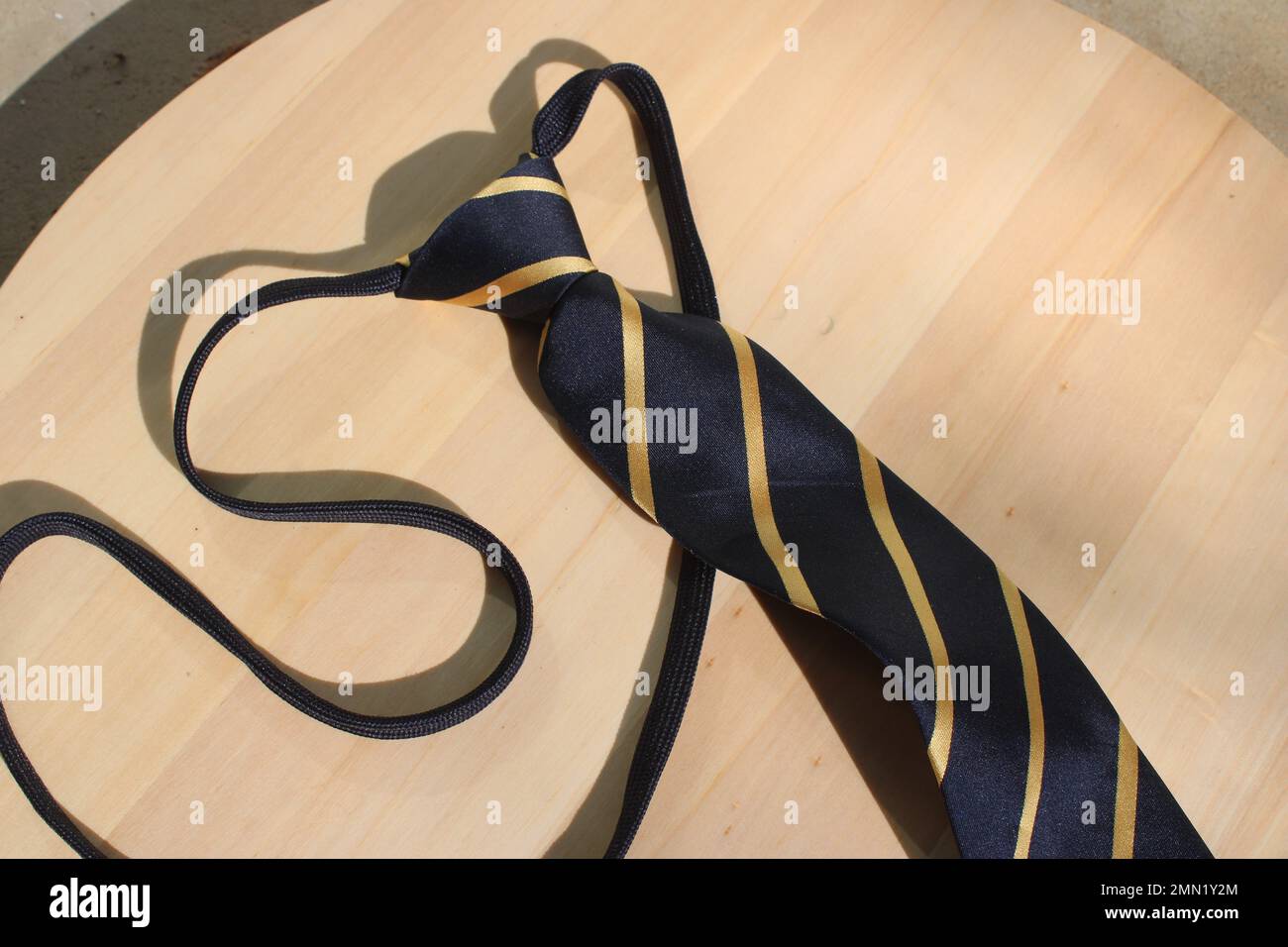 Striped necktie on table Stock Photo
