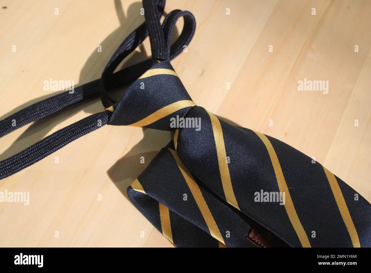 Striped necktie on table Stock Photo