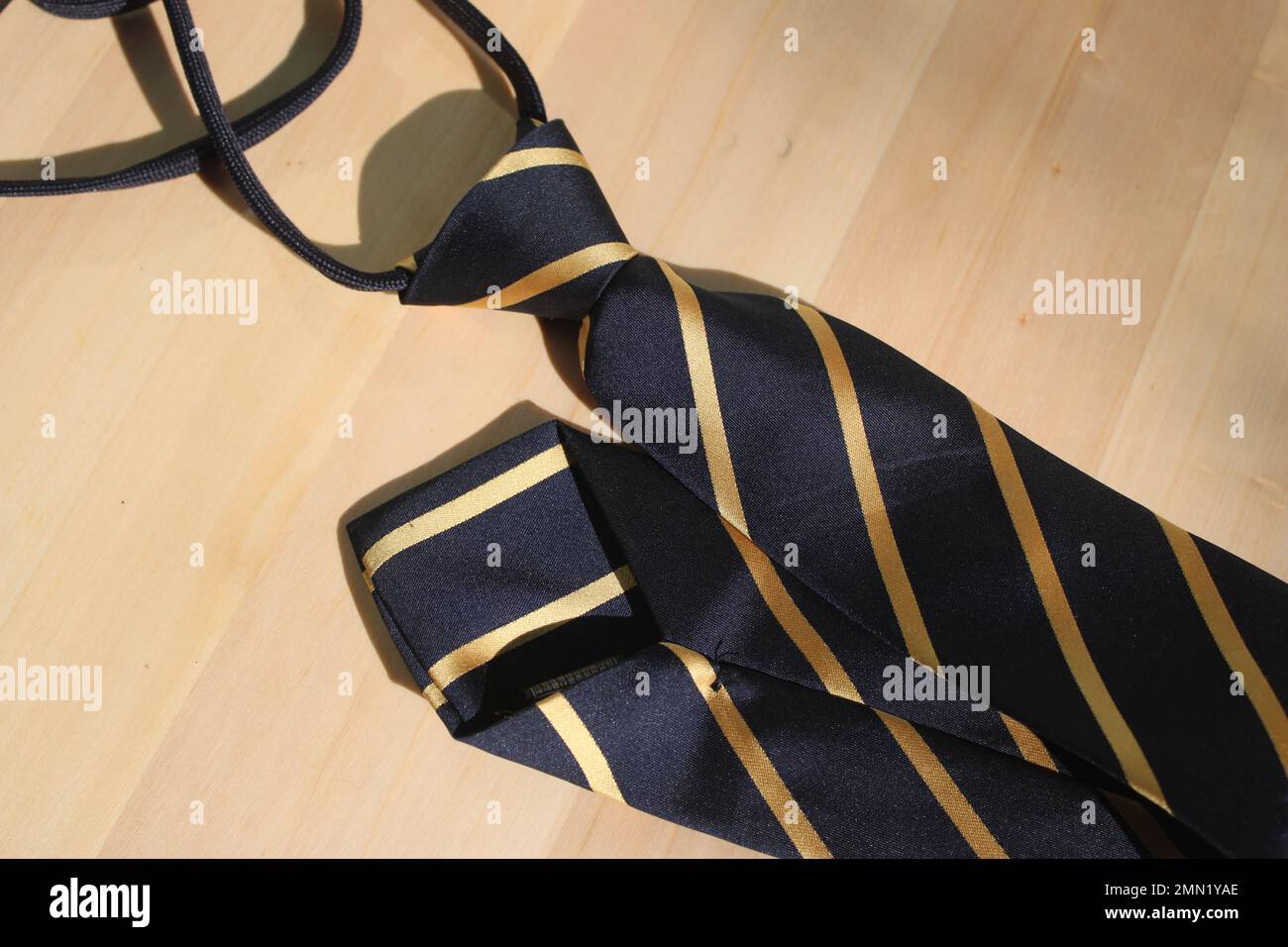 Striped necktie on table Stock Photo
