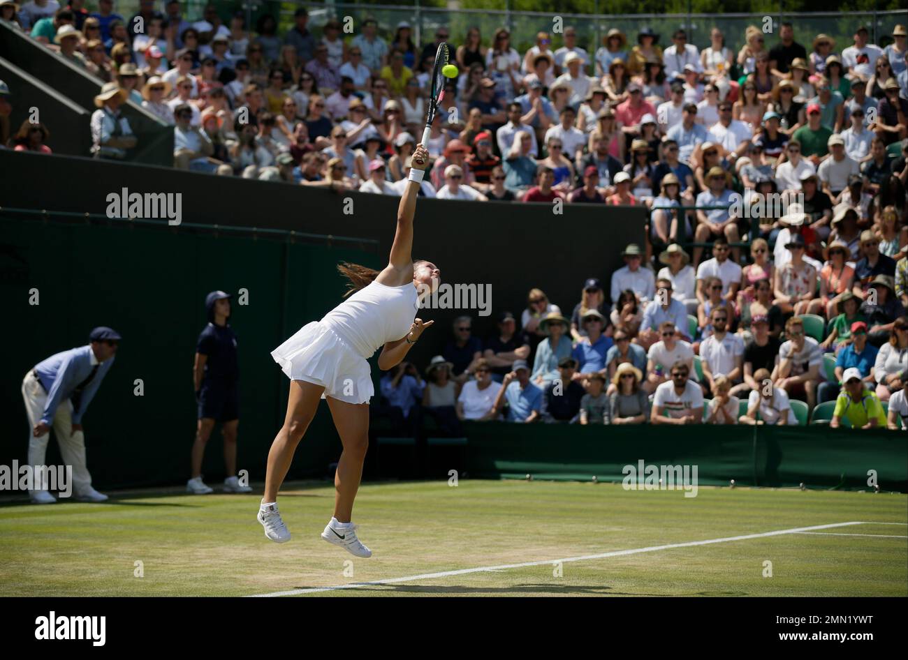 Daria Kasatkina of Russia serves to Ashleigh Barty of Australia during  their women's singles match on the sixth day at the Wimbledon Tennis  Championships in London, Saturday July 7, 2018. (AP Photo/Tim