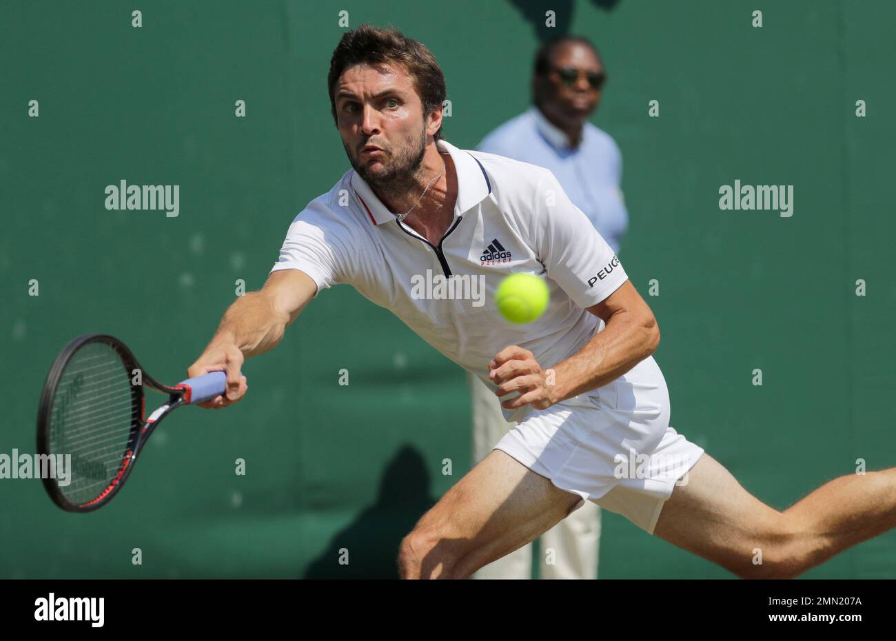 Gilles Simon of France returns a ball to Matthew Ebden of Australia during  their men's singles match on the sixth day at the Wimbledon Tennis  Championships in London, Saturday July 7, 2018. (