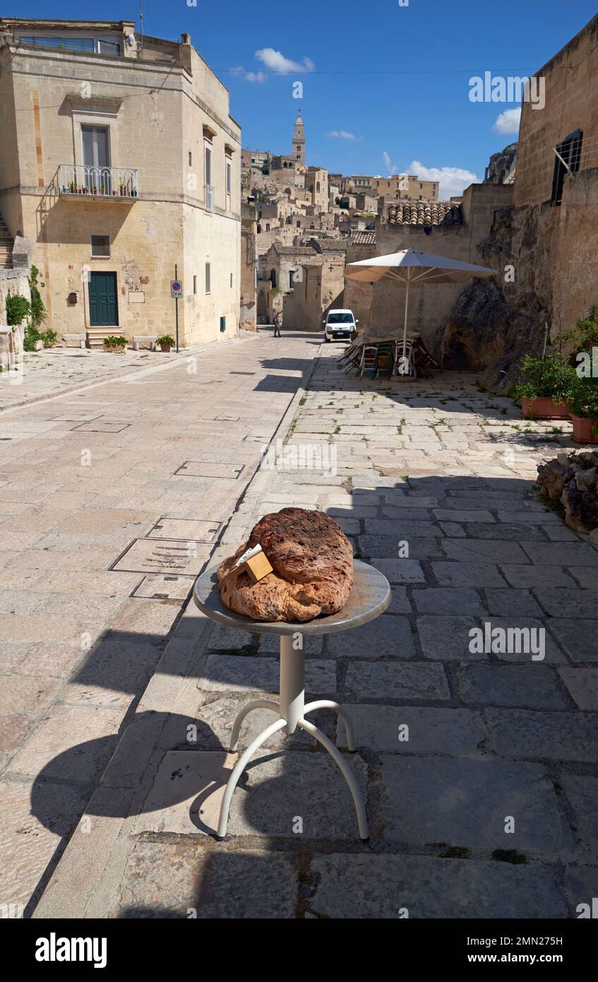 Traditional Pane di Matera (Matera's bread) on display outside a bakery in the Sassi (ancient town) of Matera, Basilicata, Italy. Stock Photo