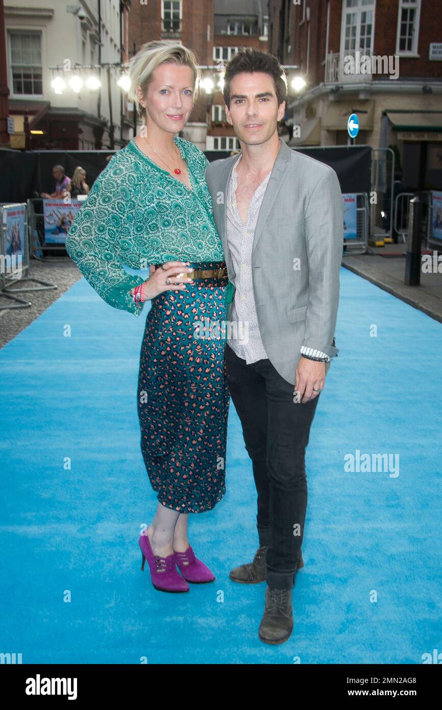 Singer Kelly Jones and Jakki Healy, left, pose for photographers upon ...