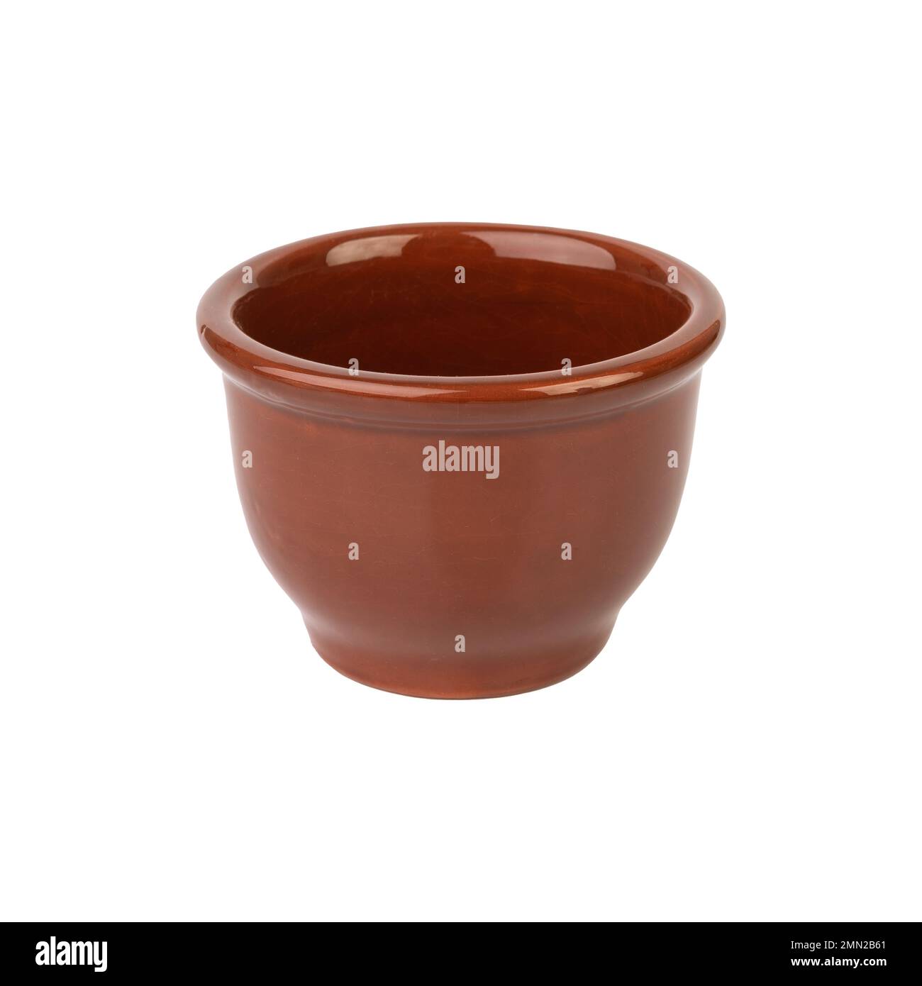 Rustic brown ceramic bowl isolated over white background. Stock Photo