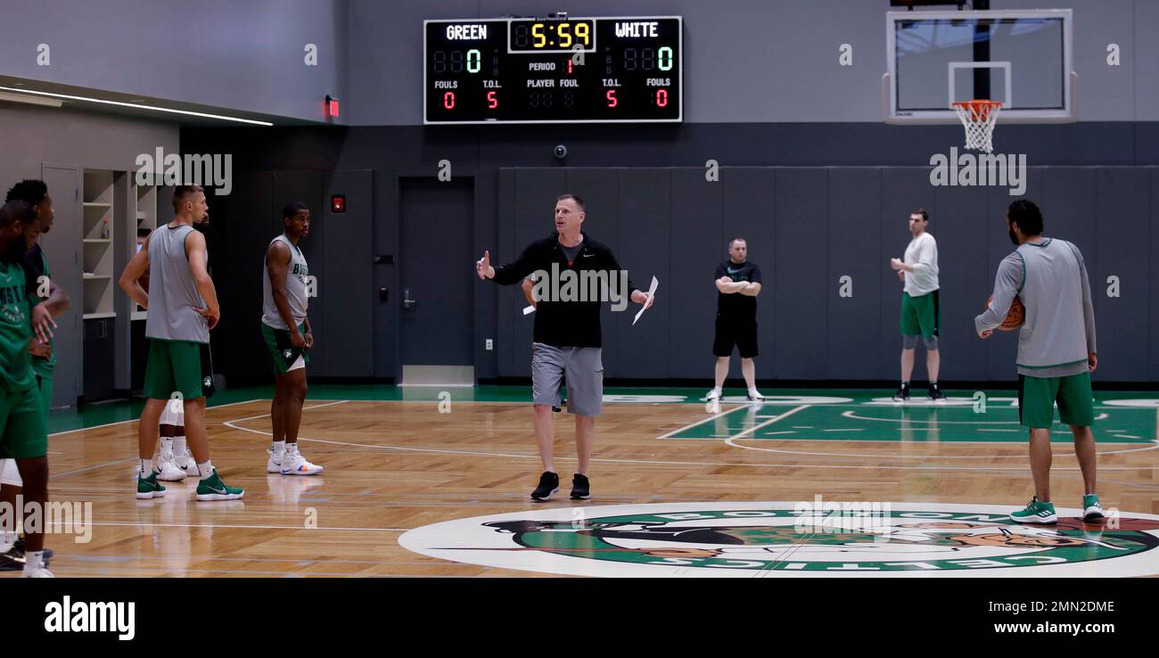 Boston Celtics assistant coach Jay Larranaga, center, instructs players