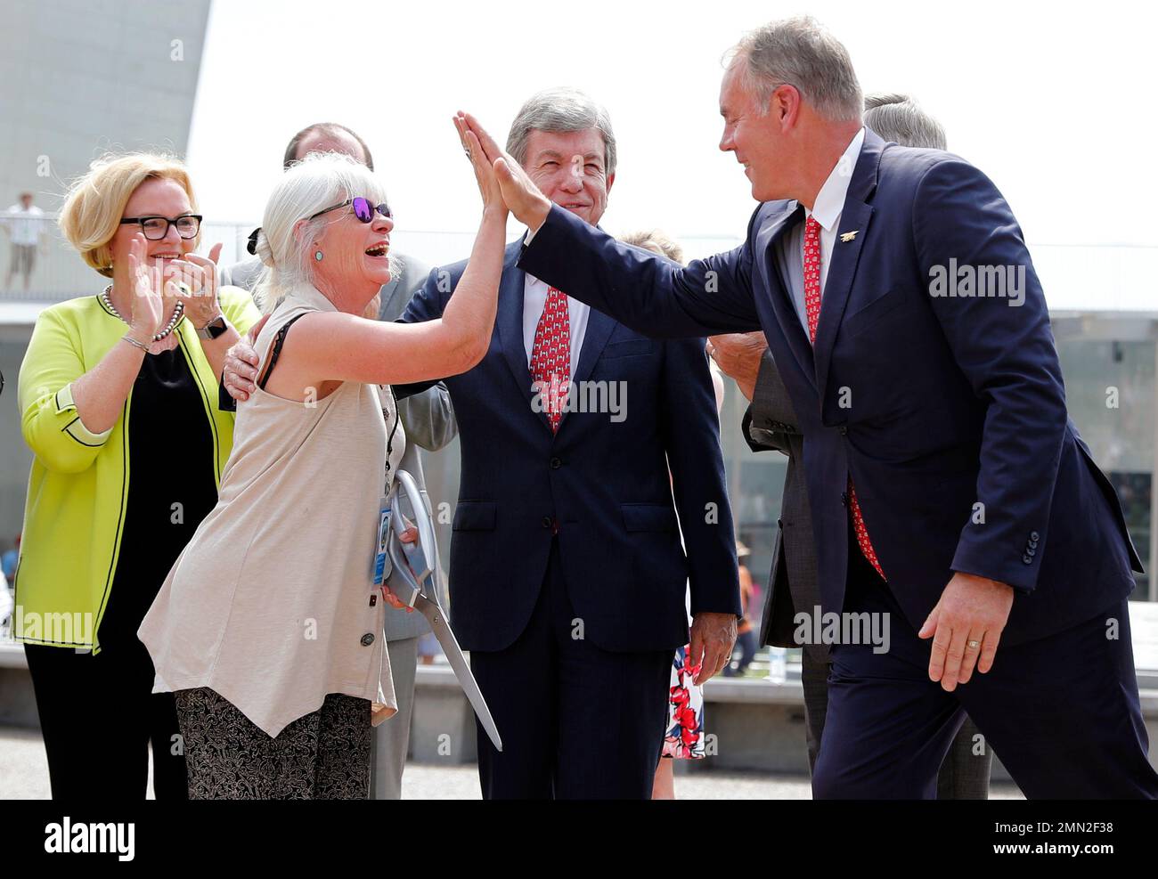 Susan Saarinen, daughter of Gateway Arch architect Eero Saarinen, is  congratulated by U.S. Interior Secretary Ryan Zinke, right, as U.S. Sens.  Claire McCaskill, left, and Roy Blunt, second from right, watch after