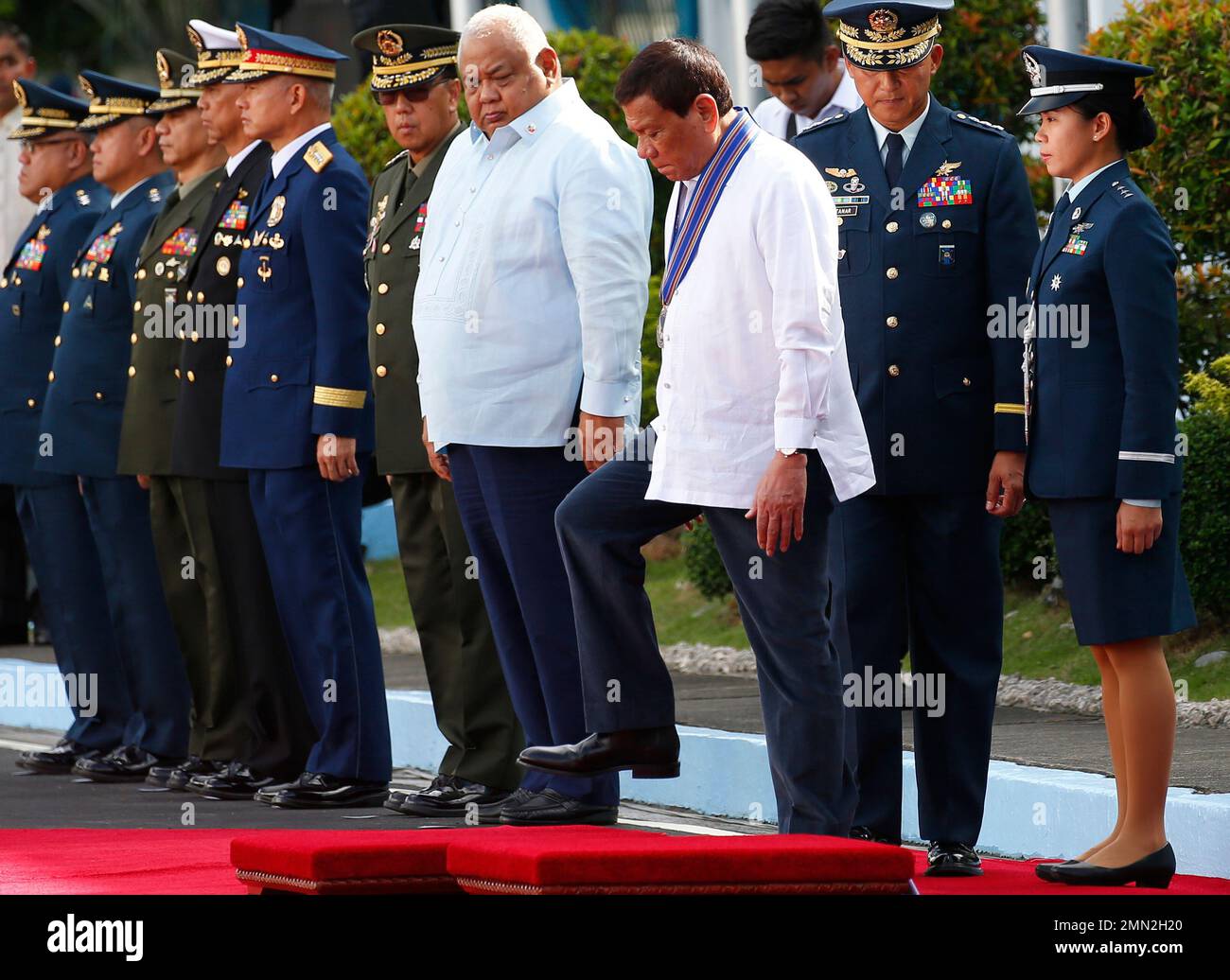 Philippine President Rodrigo Duterte steps on the dais upon reviewing