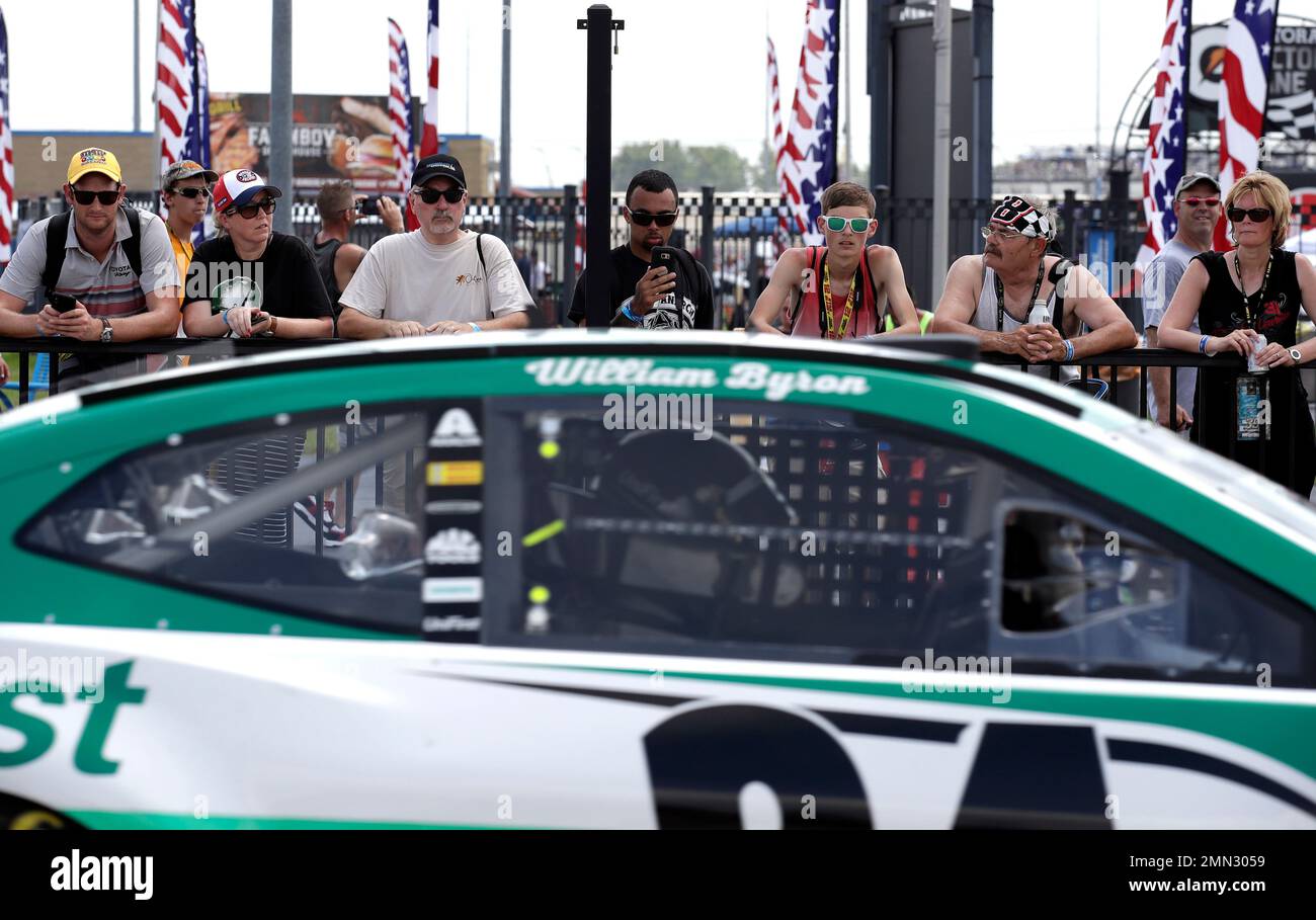 Racing fans watch William Byrons car during a practice session for the NASCAR Cup Series auto race at Chicagoland Speedway in Joliet, Ill., Saturday, June 30, 2018