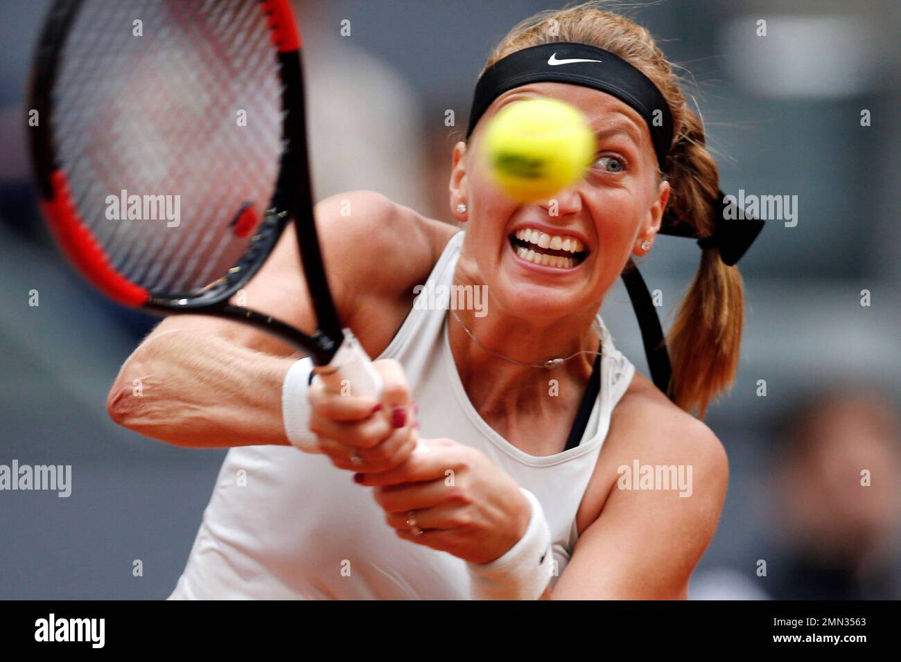 FILE - In this May 12, 2018, file photo, Czech Republic's Petra Kvitova  returns a ball to The Netherlands' Kiki Bertens during a Madrid Open tennis  tournament final match in Madrid, Spain.