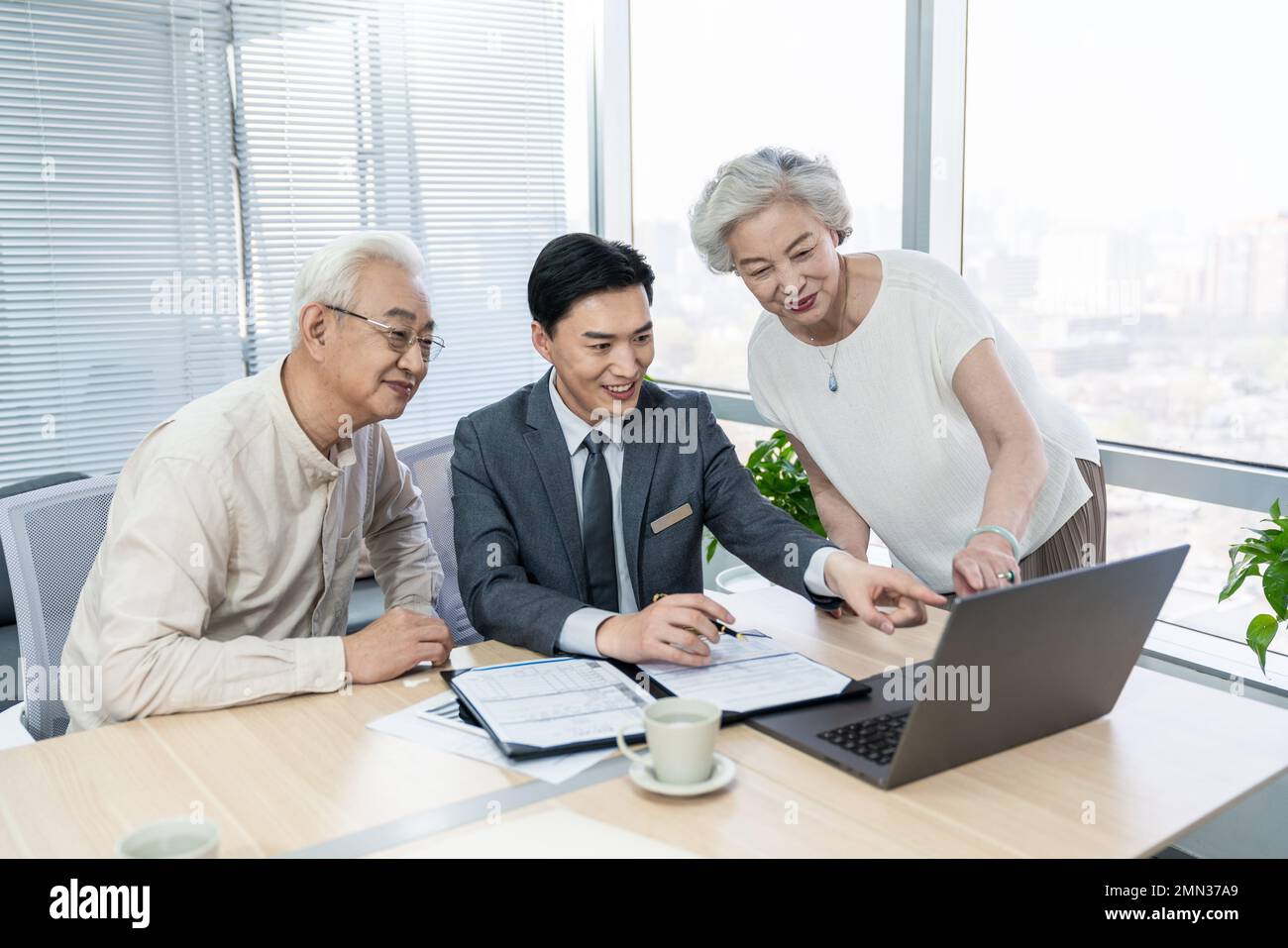 Older couples with a financial adviser Stock Photo