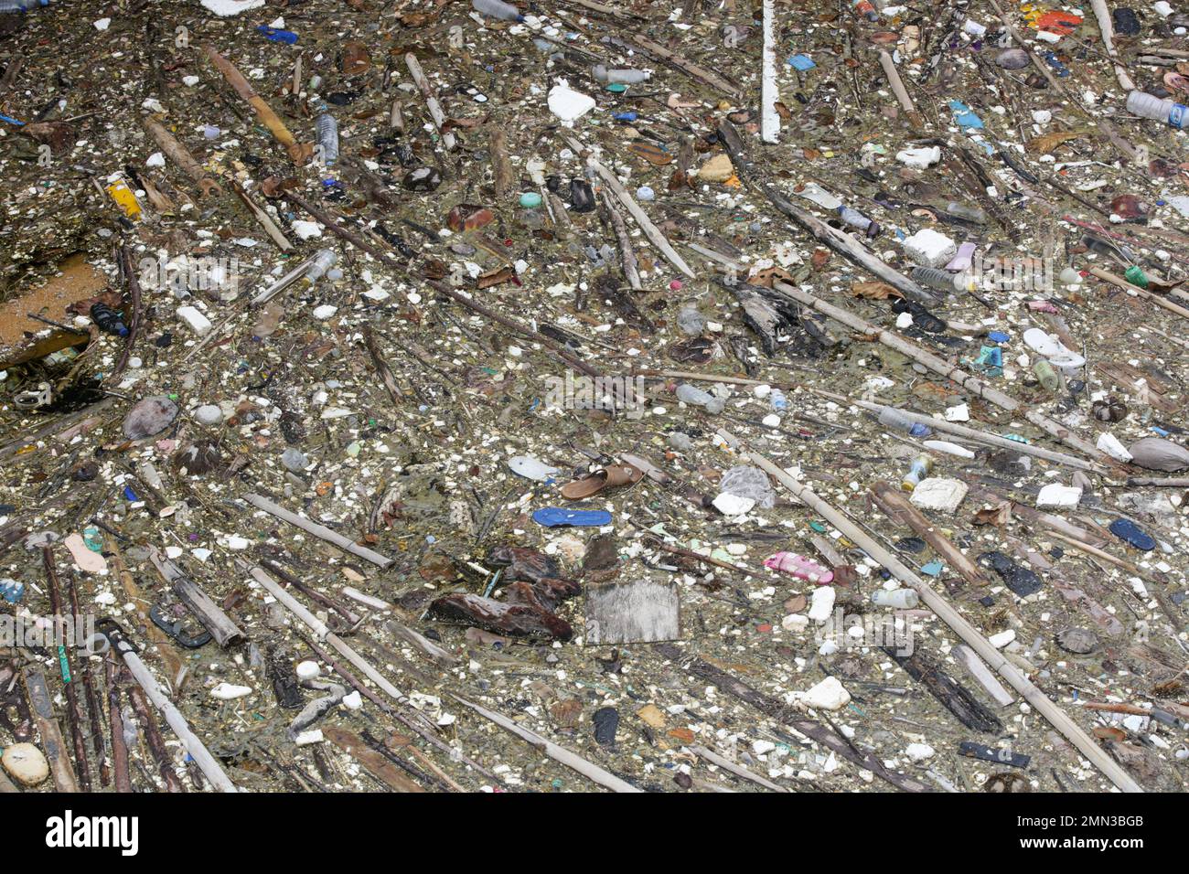 A giant floating rubbish heap floating in the river, plastic pollution