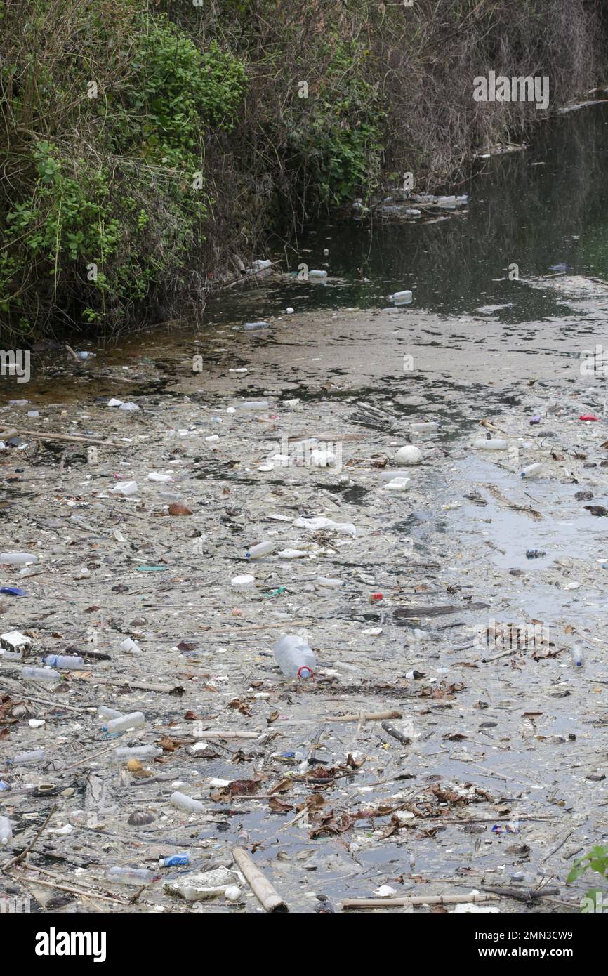 A giant floating rubbish heap floating in the river, plastic pollution