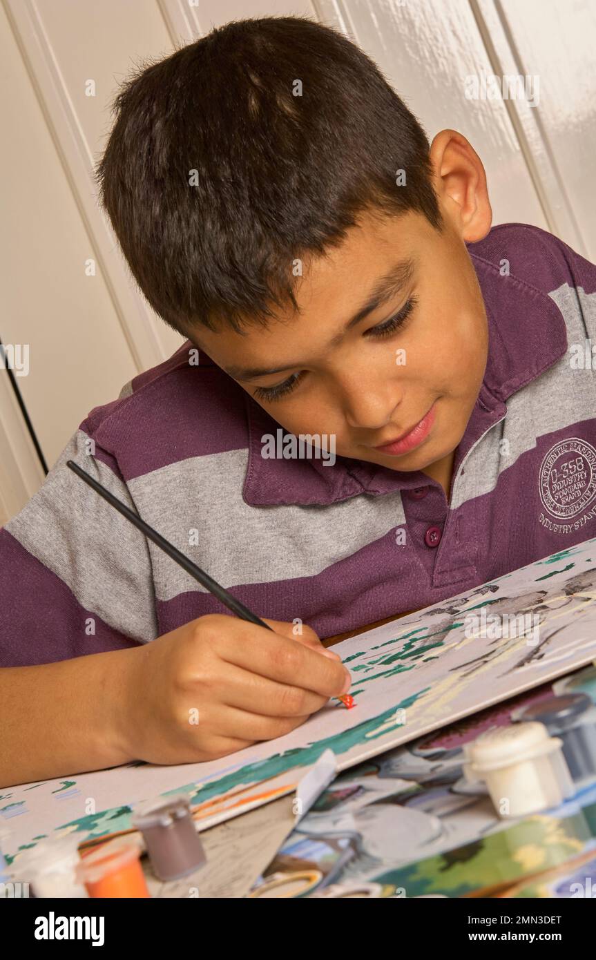 Asian kid drawing and do homework on the bed Photograph by Anek  Suwannaphoom - Fine Art America