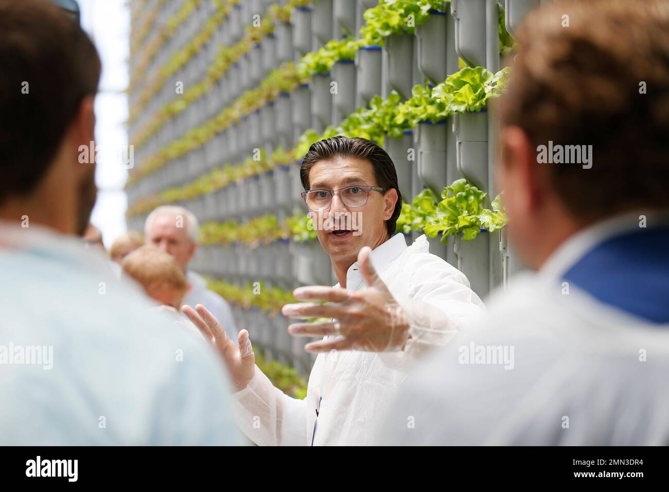 Eden Green Technology CoChairman Jaco Booyens leads a greenhouse tour
