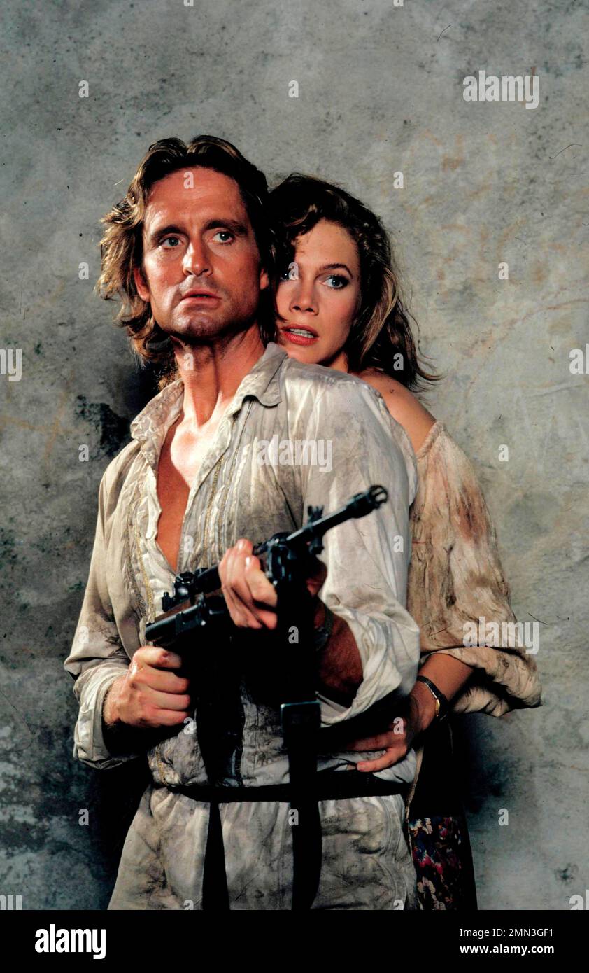 KATHLEEN TURNER and MICHAEL DOUGLAS in ROMANCING THE STONE (1984), directed by ROBERT ZEMECKIS. Credit: 20TH CENTURY FOX / Album Stock Photo