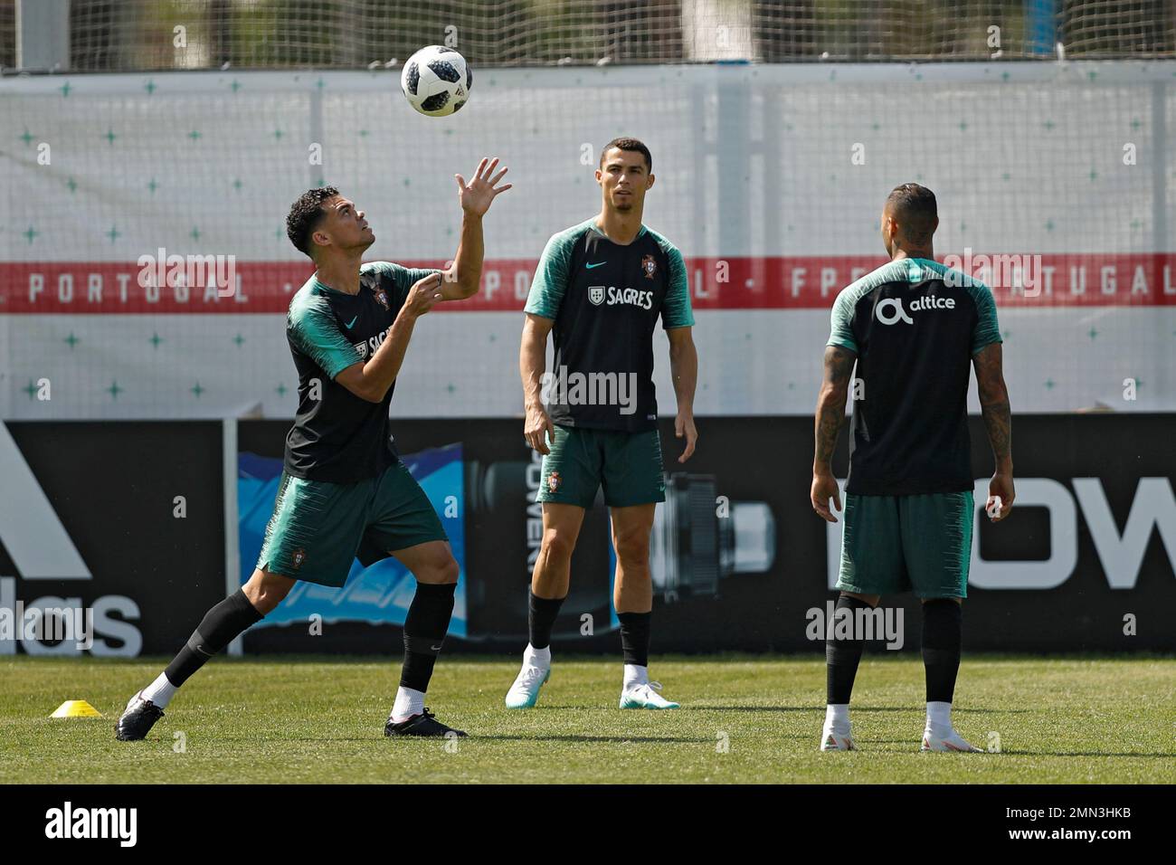 Portugal's Cristiano Ronaldo heads the ball during a team training