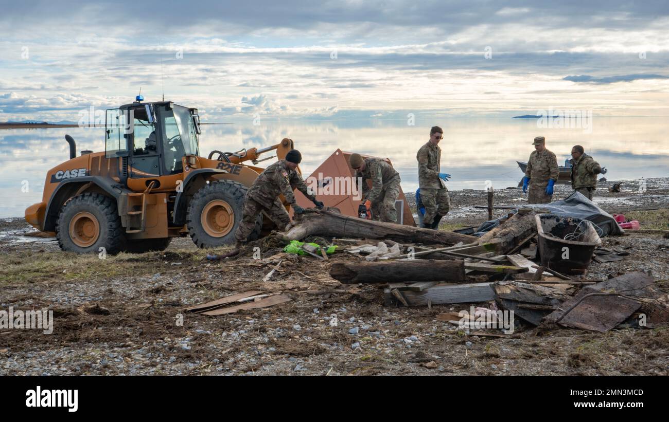 Alaska Air and Army National Guardsmen clean up storm debris for