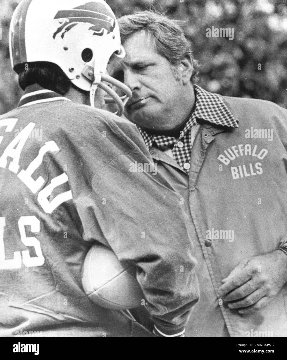 Jim Ringo, who was an assistant coach with the Buffalo Bills until head  coach quit Friday, talks with quarterback Joe Ferguson during the first  quarter of the game against the Baltimore Colts