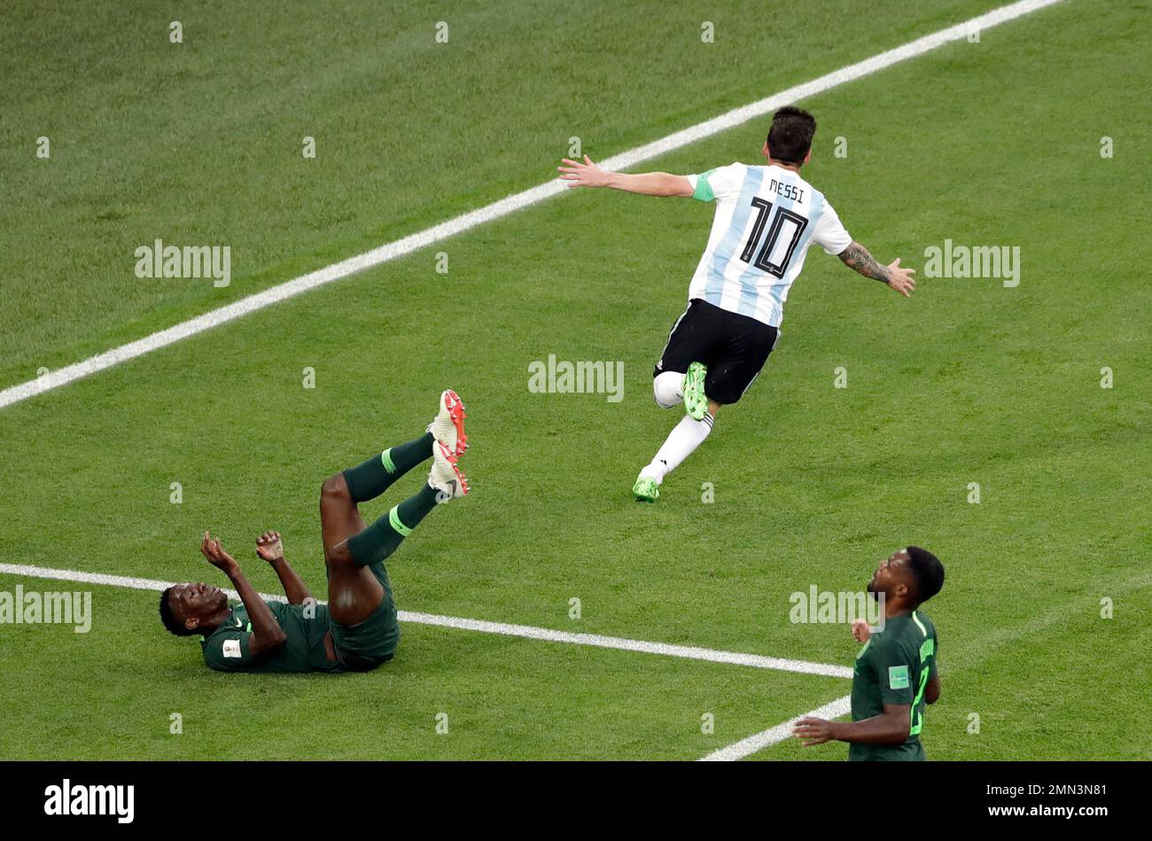Argentina's Lionel Messi, top, celebrates after scoring the opening goal  during the group D match between Argentina and Nigeria, at the 2018 soccer  World Cup in the St. Petersburg Stadium in St., image size:1300x949