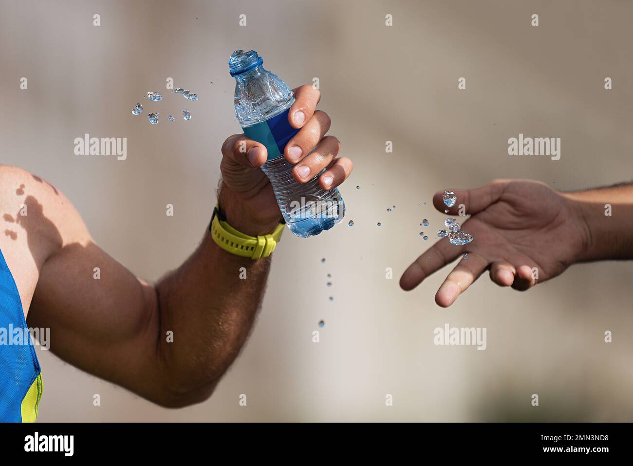 Drinks station at a running marathon, hydration drinking during a race