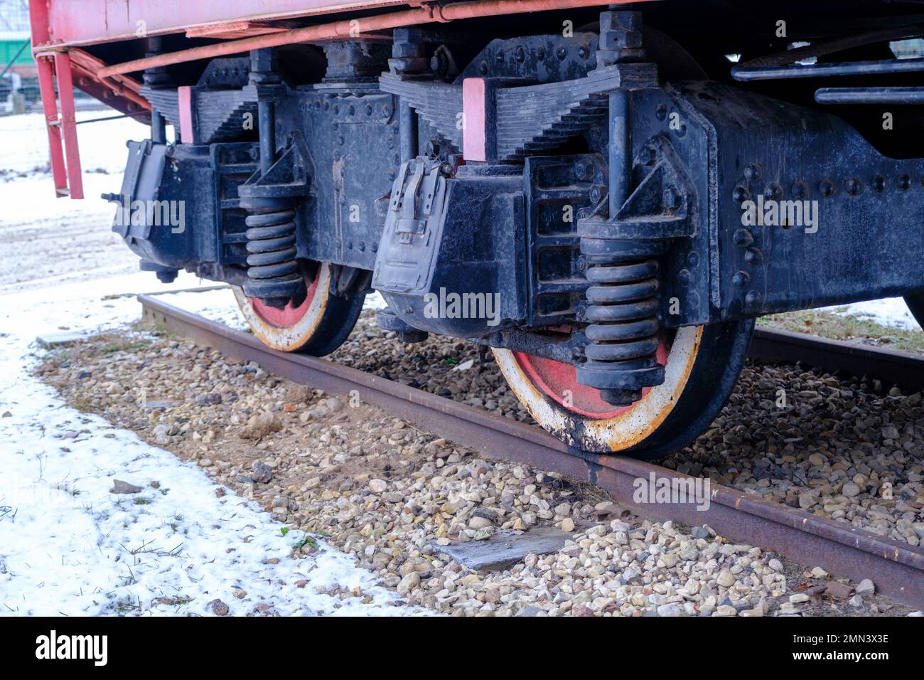 Old steam locomotive wheel and connecting rods. Tie rod or side rod for drive wheels. A retro specimen. Stock Photo