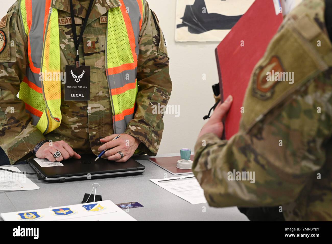 An Airman checks in with the judge advocate office during a pre