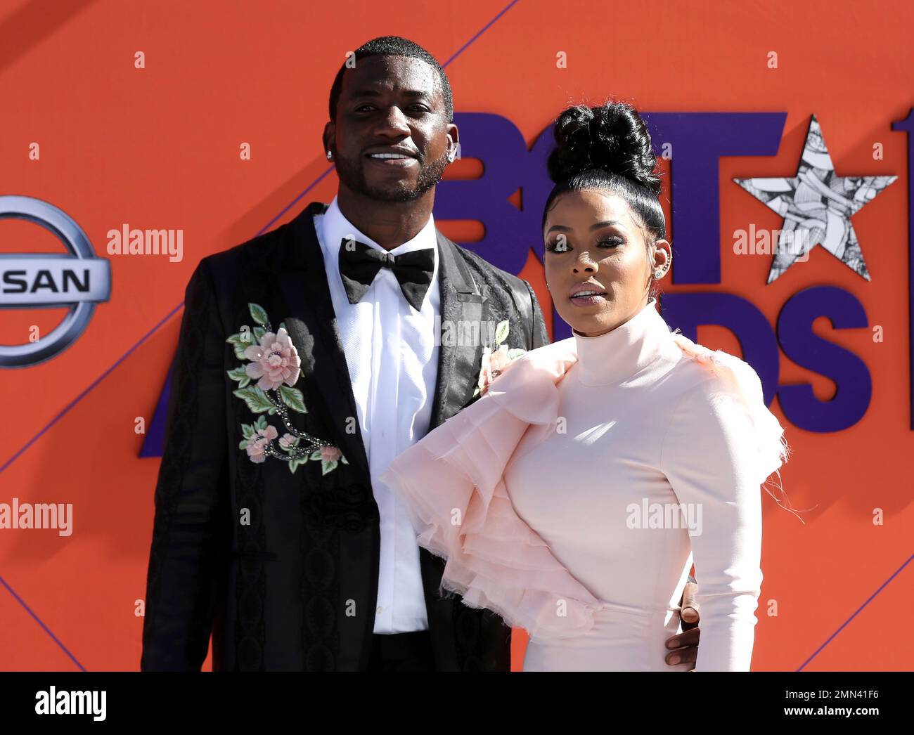 Rapper Gucci Mane, left, and his wife, Keyshia Ka'Oir, sit courtside during  the NBA All-Star Saturday Night festivities at Spectrum Center in  Charlotte, N.C., on Saturday, Feb. 16, 2019. (Photo by Jeff