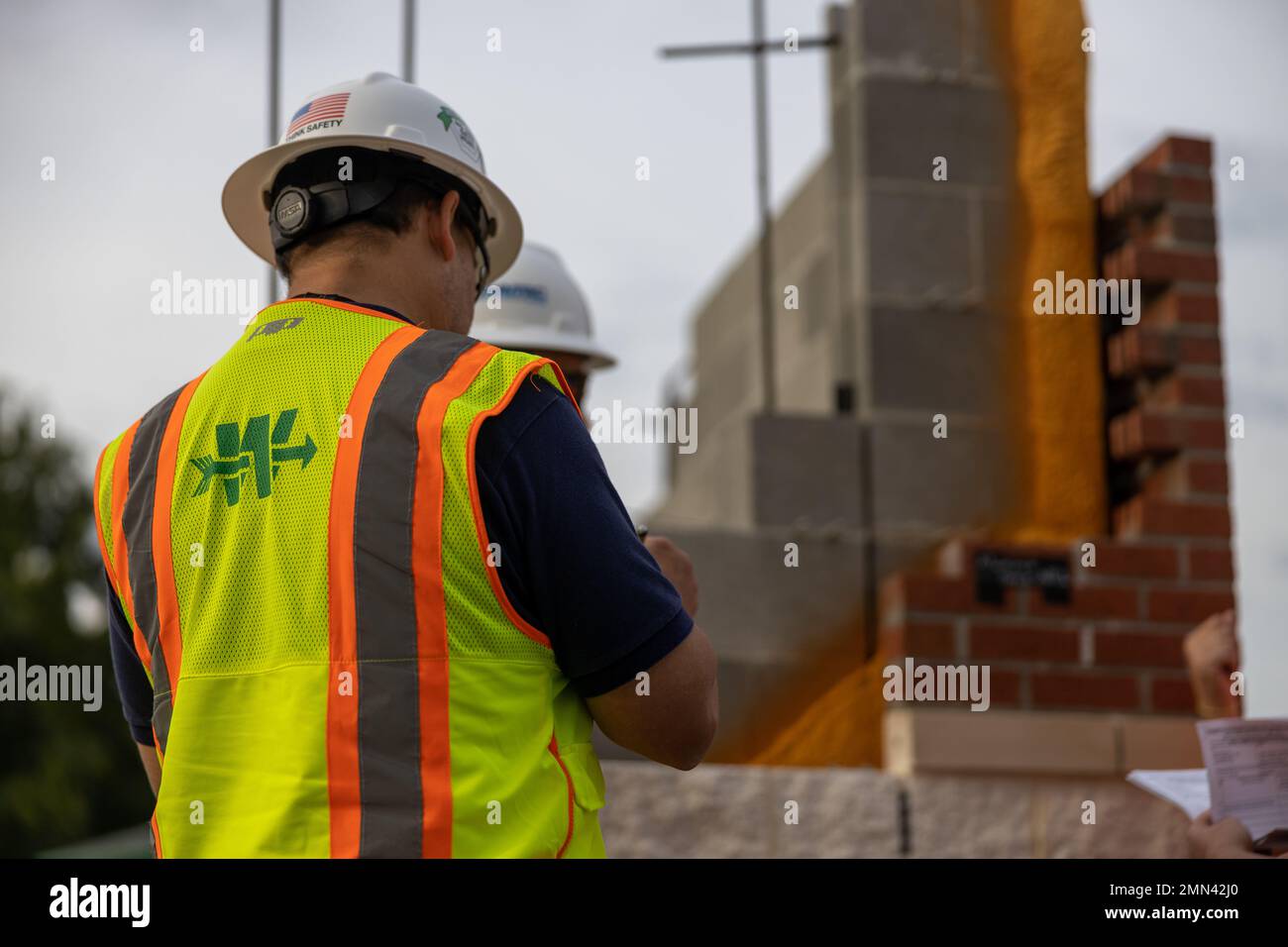 A Civilian Contractor With Archer Western LLC Conducts A Site Survey As a-civilian-contractor-with-archer-western-llc-conducts-a-site-survey-as