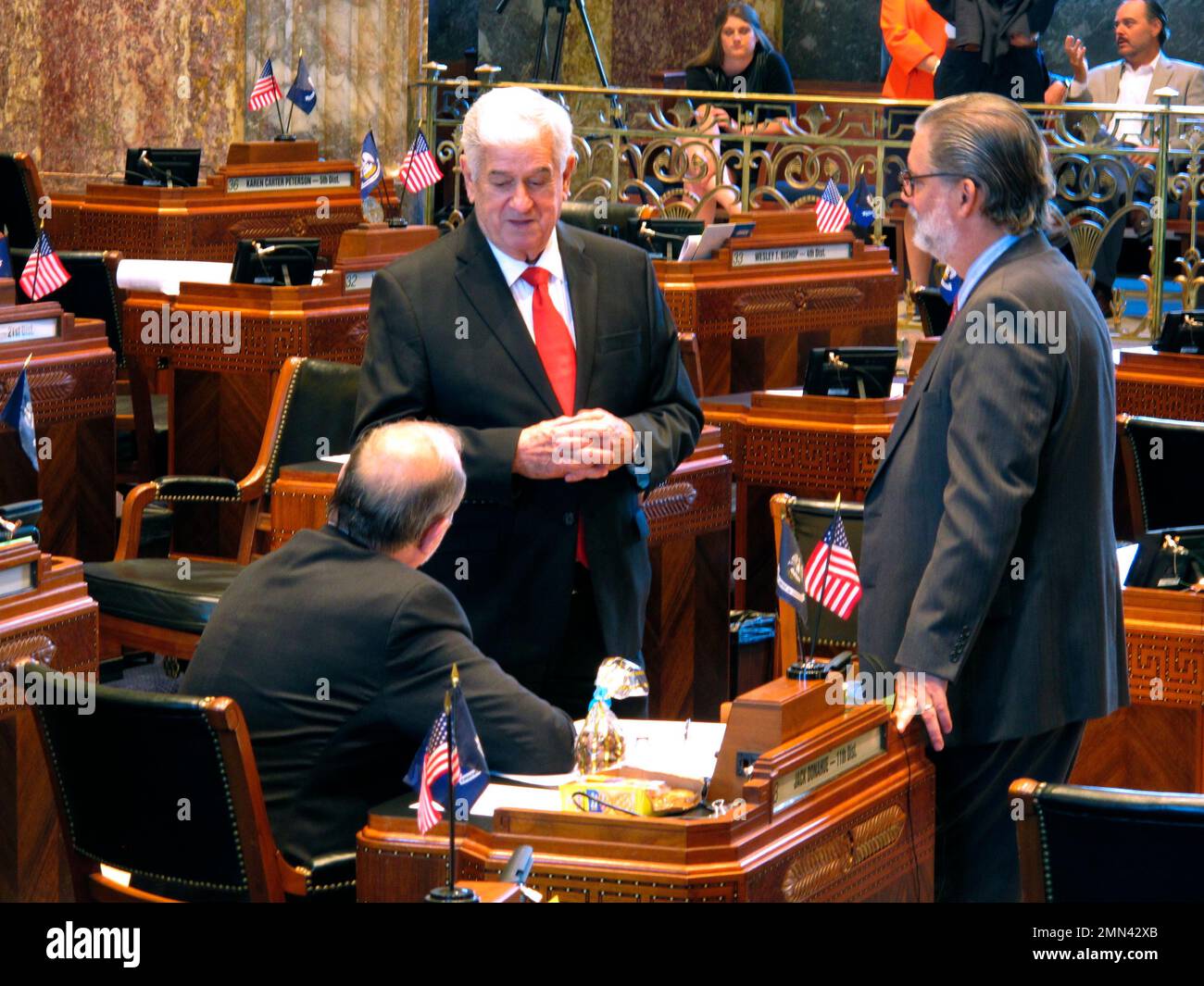 Senate President John Alario, RWestego, center, speaks with Sens. Jack