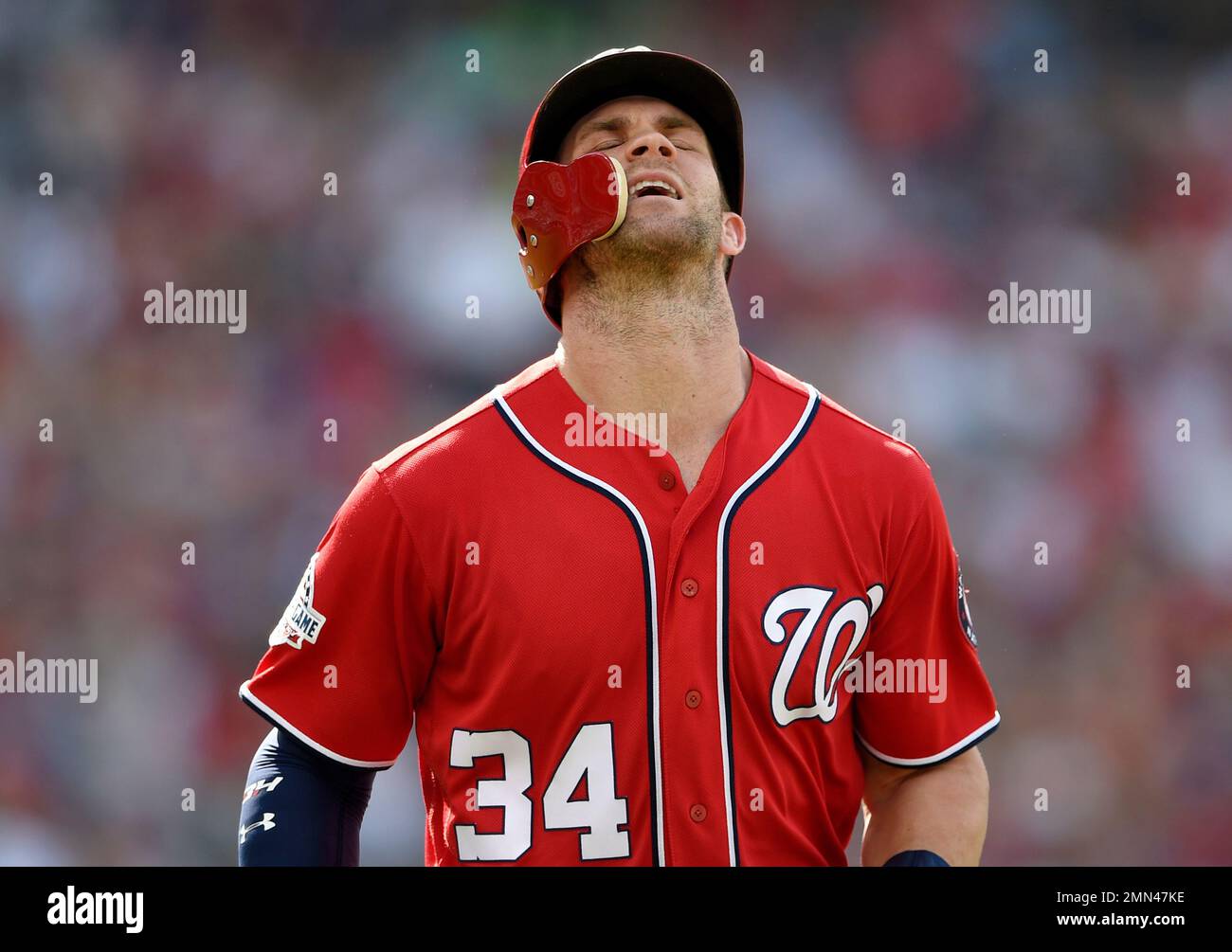 Washington Nationals Bryce Harper reacts in the dugout during game against  the New York Mets in the 3rd inning of game on Opening Day at Nationals  Park on April 6, 2015 in