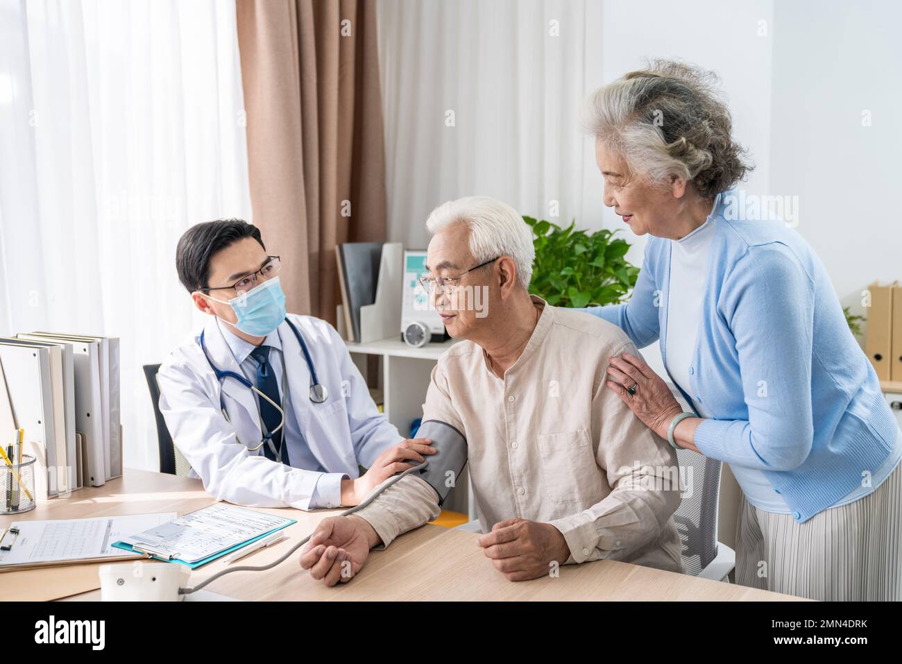 Family of three standing in masks hi-res stock photography and images ...
