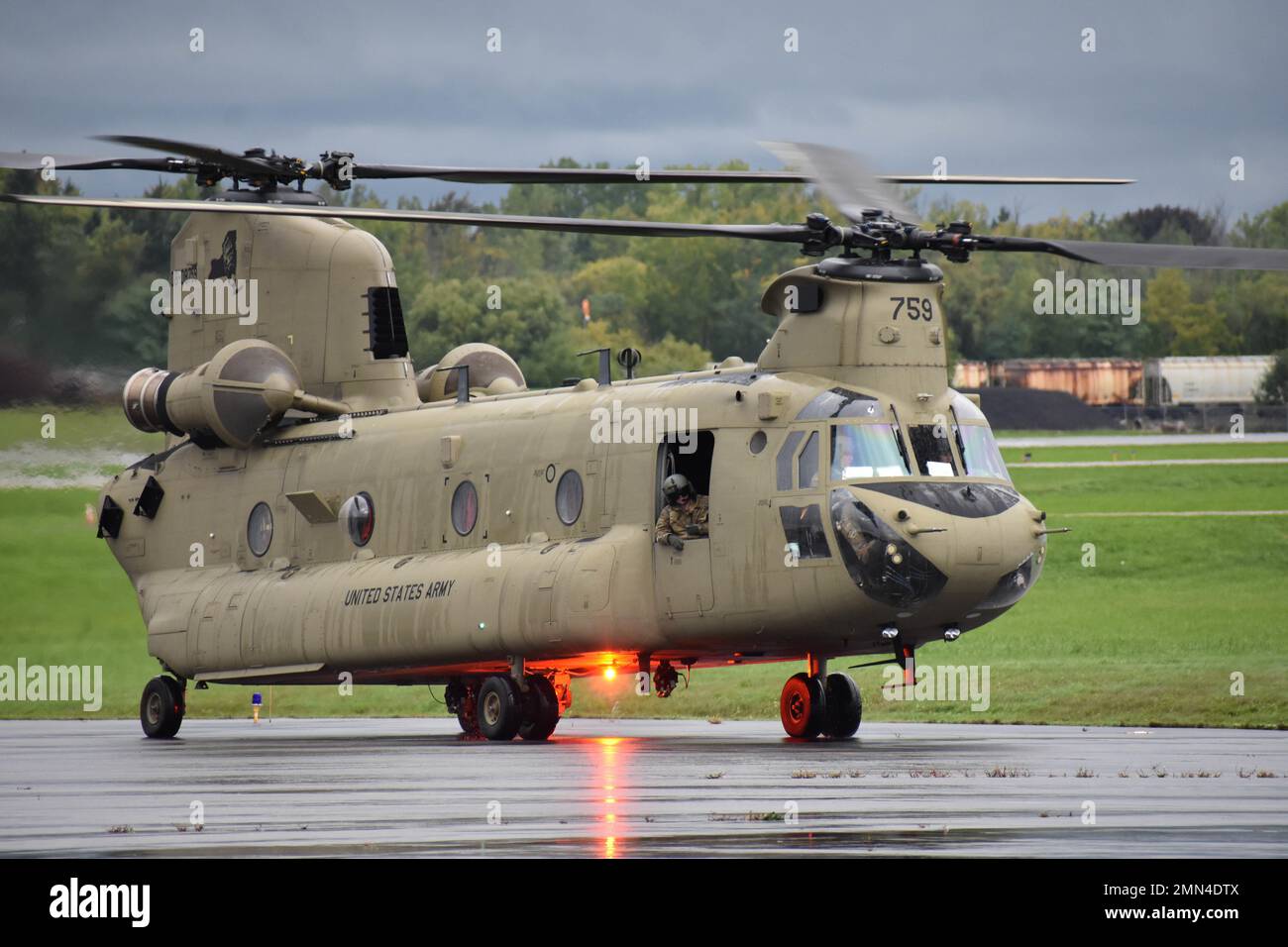 A CH-47 assigned to B Company, 3rd Battalion, 126th Aviation Regiment, NY National Guard taxis to the runway at Greater Rochester International Airport, Rochester NY, Sept. 28 2022. Soldiers and crew were called up in support of emergency measures in Florida, brought on by Hurricane Ian. Air National Guard photo by 1st Lt. Jason Carr Stock Photo