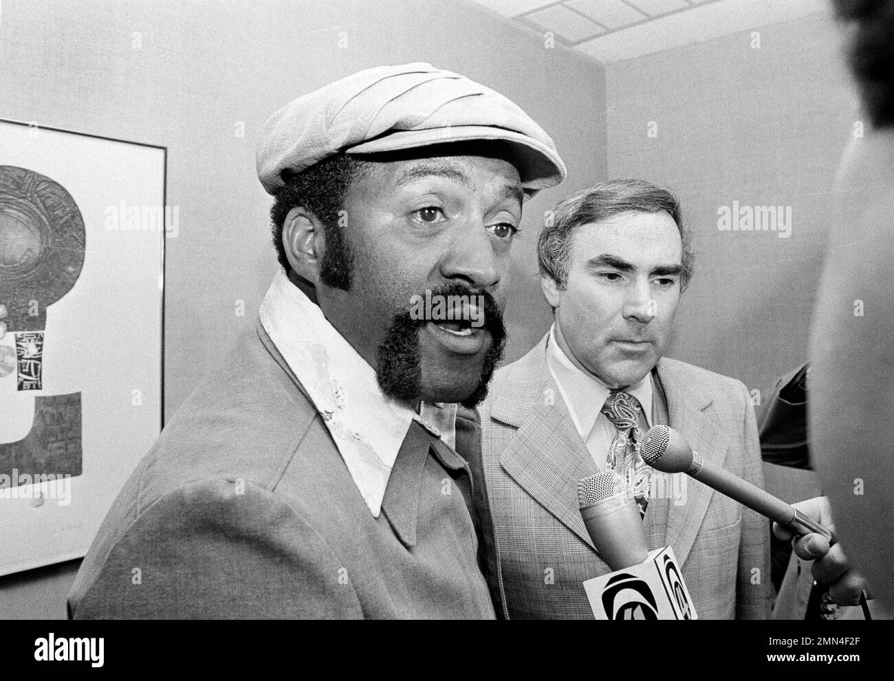 Boston Red Sox pitcher Luis Tiant, center, and his wife, Maria, walk from  the plane at Logan International Airport in Boston, mass., on arrival from  Oakland, Calif., where the Red Sox defeated