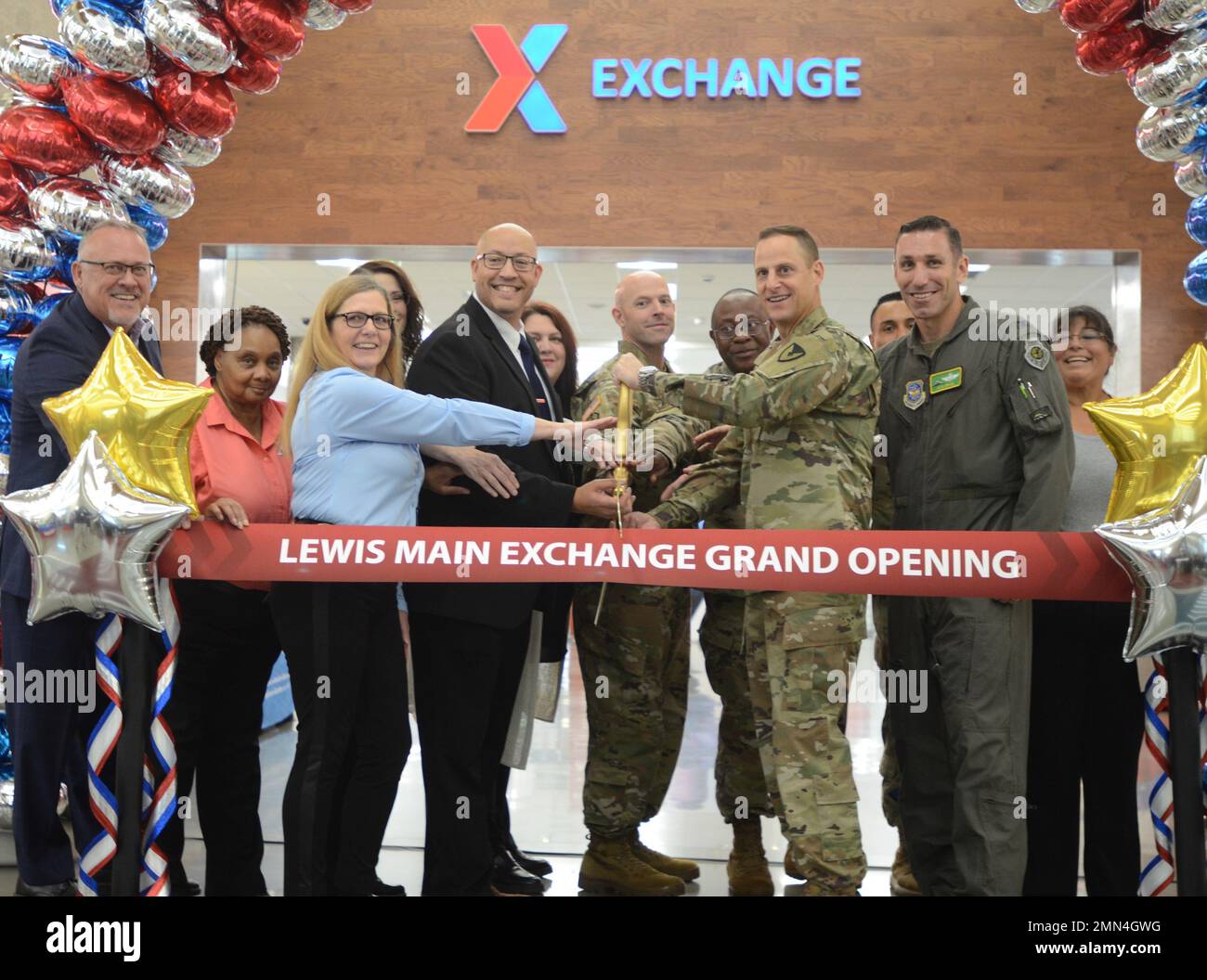 Matthey Beatty and Col. Phil Lamb prepares to jointly cut the ribbon as