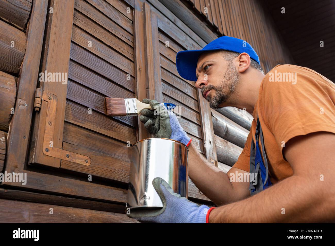 Painting or staining woodwork outside Stock Photo Alamy